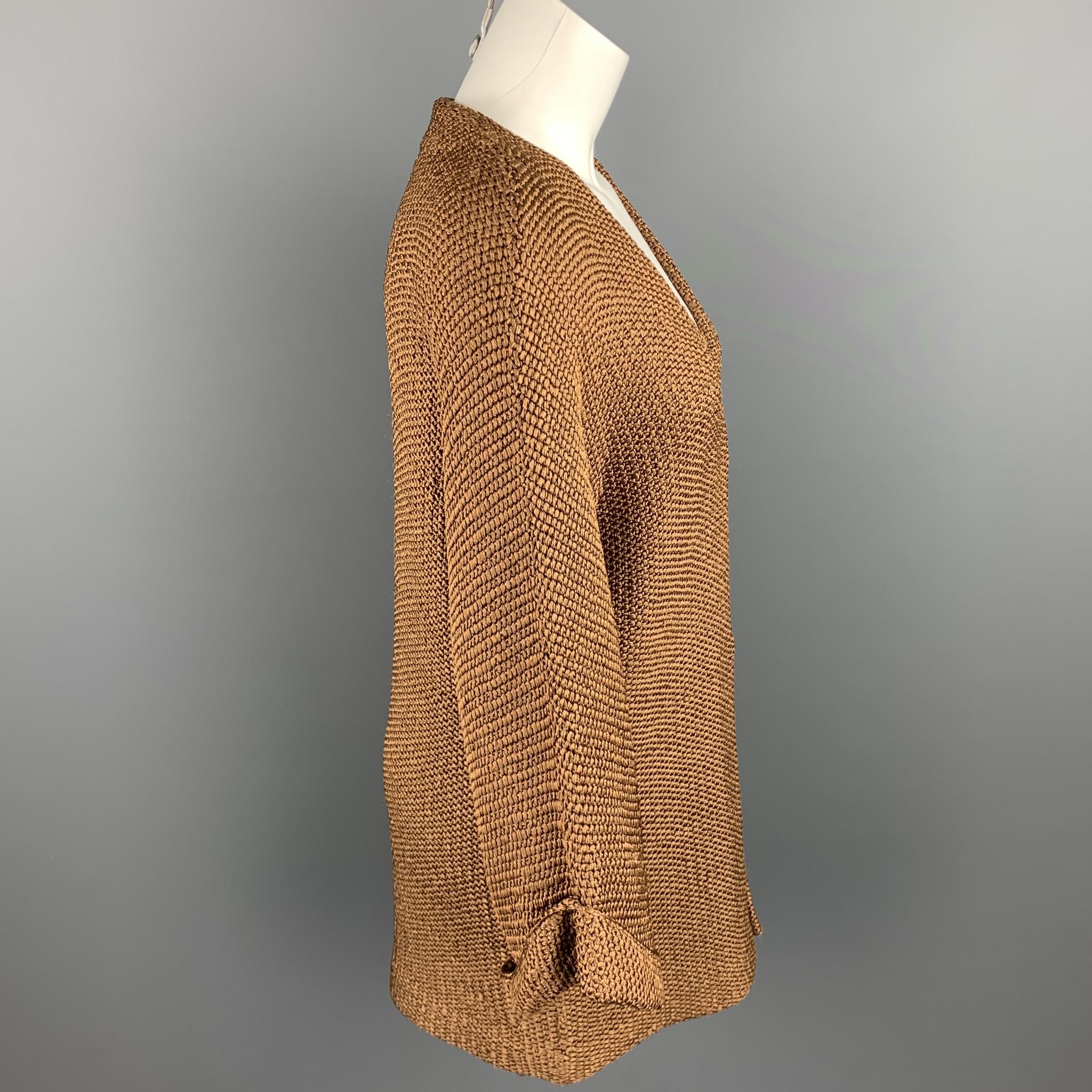 RALPH LAUREN COLLECTION cardigan comes in a copper knitted textured silk featuring 3/4 sleeves and a open front. 

Very Good Pre-Owned Condition.
Marked: S

Measurements:

Shoulder: 16.5 in. 
Bust: 38 in. 
Sleeve: 17.5 in. 
Length: 29.5 in. 