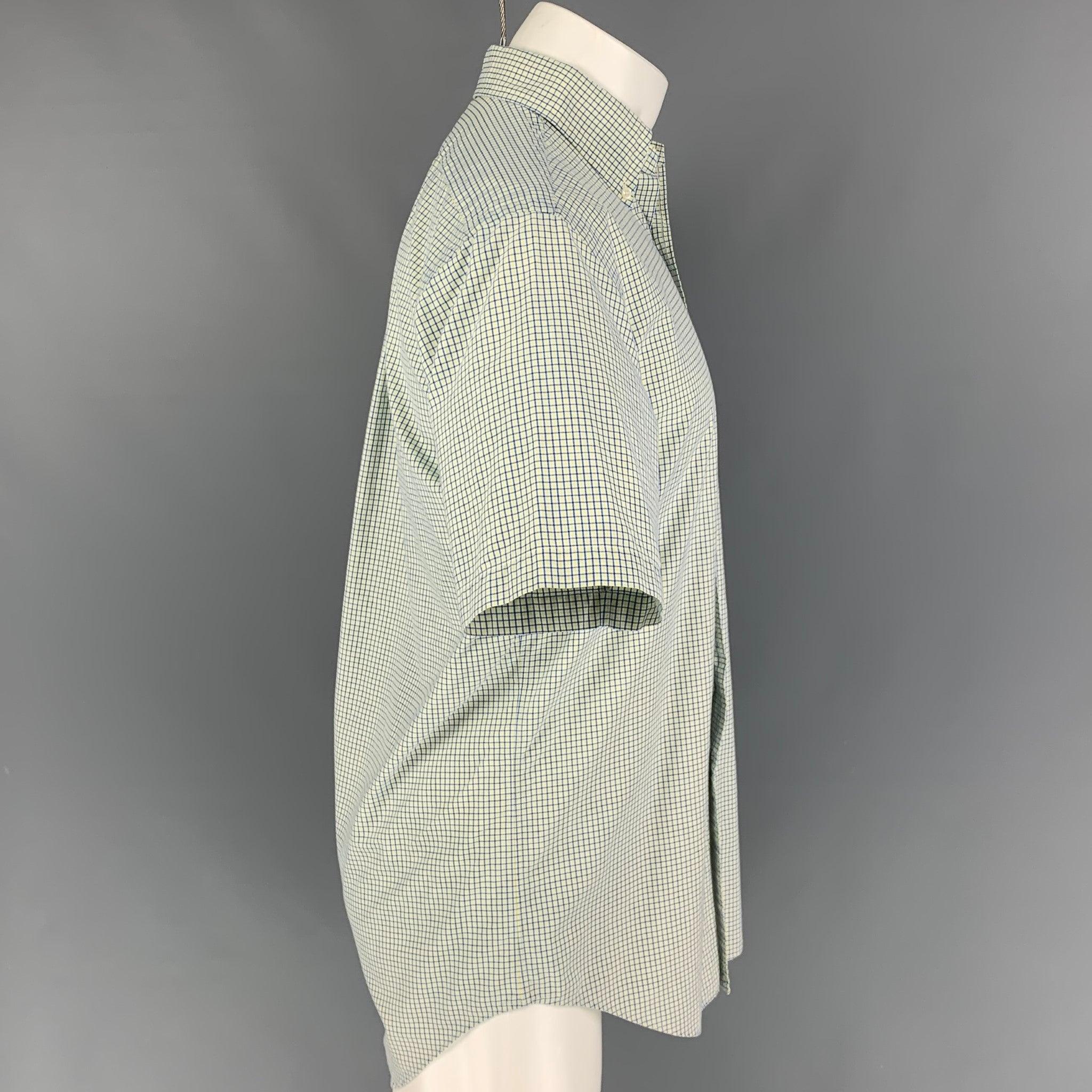 RALPH LAUREN short sleeve shirt comes in a green & blue checkered cotton featuring a classic fit, button down collar, front pocket, and a button up closure.
Very Good
Pre-Owned Condition. 

Marked:   S 

Measurements: 
 
Shoulder: 18.5 inches 
