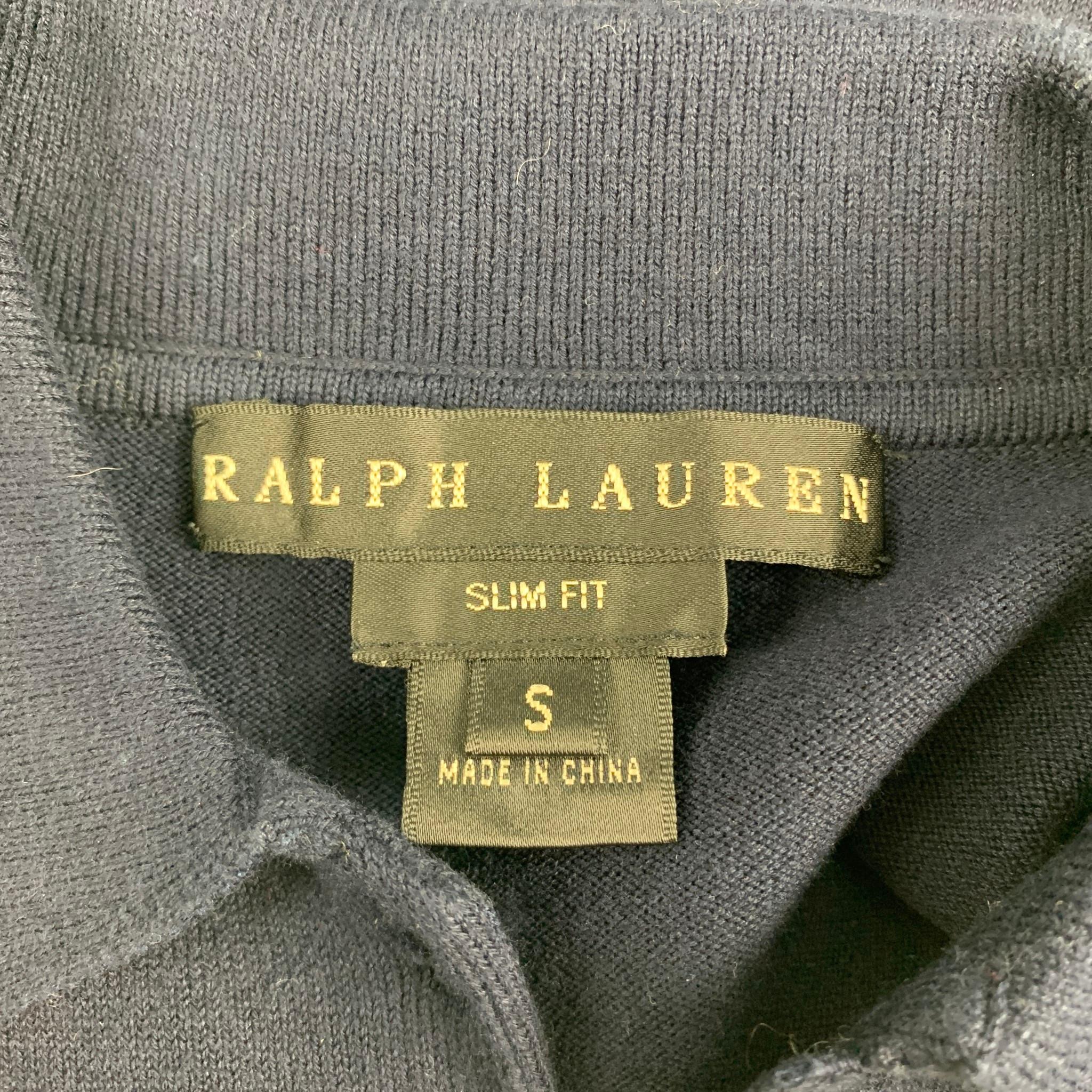 RALPH LAUREN polo comes in a navy knitted cotton blend featuring a slim fit, spread collar, and a half button closure.

Good Pre-Owned Condition.
Marked: S

Measurements:

Shoulder: 17.5 in.
Bust: 32 in.
Sleeve: 4 in.
Length: 18 in. 