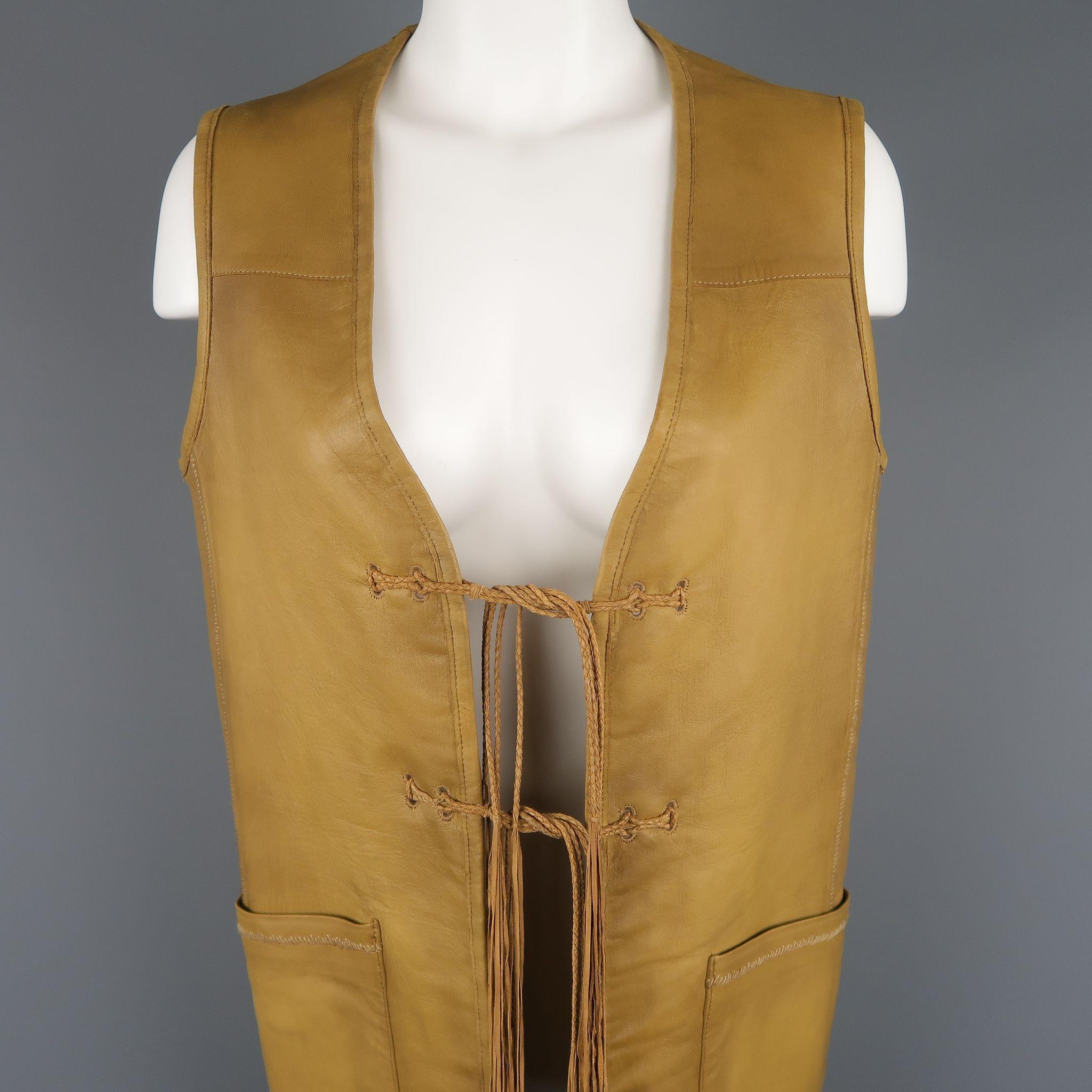 RALPH LAUREN Blue Label vest comes in tan leather with a V neck, patch pockets, tassel tied front, and striped linen interior reverse side.
 
Good Pre-Owned Condition.
Marked: S
 
Measurements:
 
Shoulder:15 in.
Bust: 38 in.
Length: 32 in.