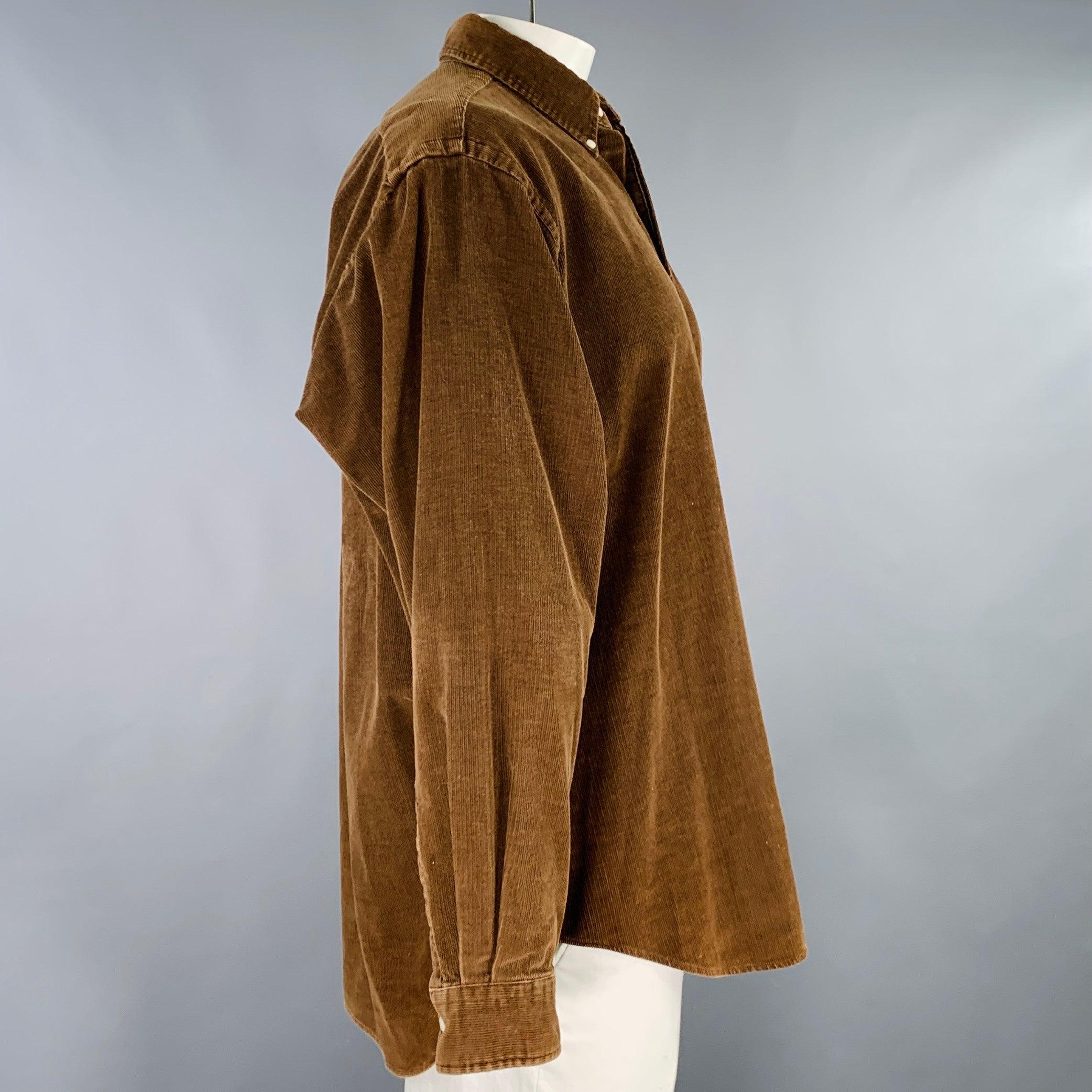 RALPH LAUREN long sleeve shirt
in a brown cotton corduroy featuring a button down collar, and button closure. Good Pre-Owned Condition. Multiple moderate marks, as is. 

Marked:   XL 

Measurements: 
 
Shoulder: 21 inches Chest: 48 inches Sleeve: 25