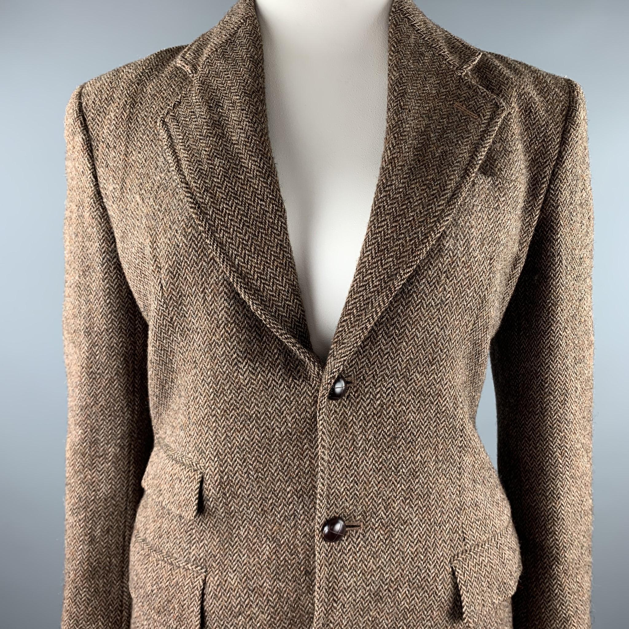 RALPH LAUREN blazer comes in a brown tweed herringbone wool with a full liner featuring a notch lapel, flap pockets, and a three button closure. Made in USA.

Very Good Pre-Owned Condition.
Marked: 4

Measurements:

Shoulder: 18 in. 
Bust: 40 in.