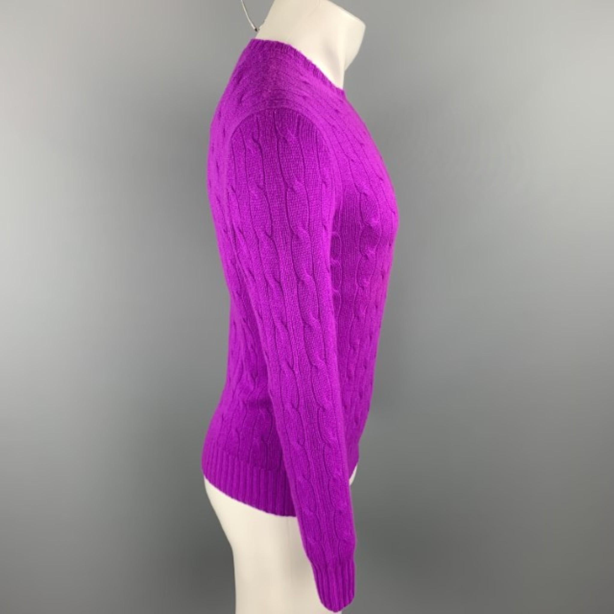 RALPH LAUREN sweater comes in a magenta cable knit cashmere featuring a crew-neck. 

New With Tags.
Marked: XS
Original Retail Price: $398.00

Measurements:

Shoulder: 18.5 in. 
Chest: 38 in. 
Sleeve: 25 in.
Length: 25 in. 