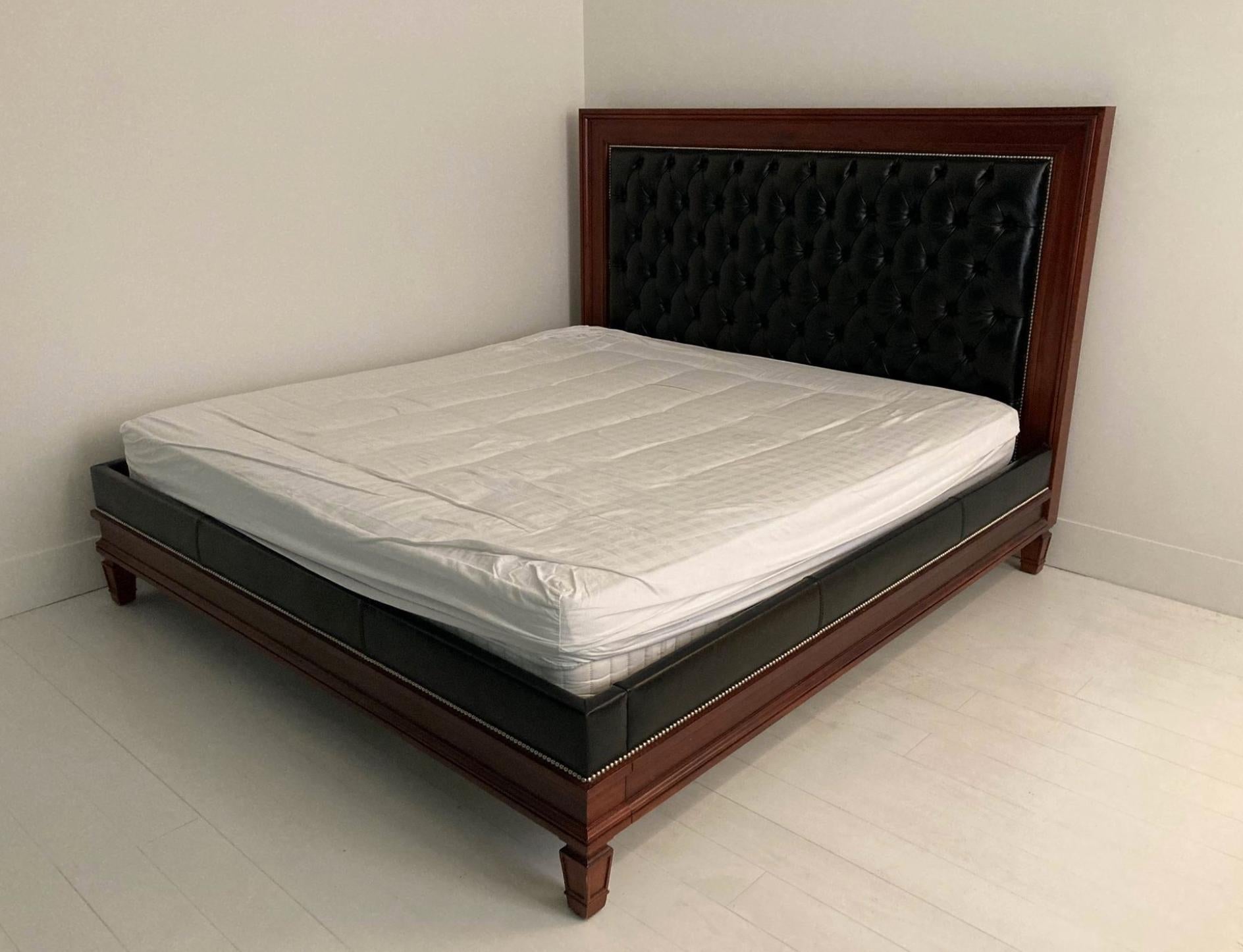 Ralph Lauren House (founded in 1967).
Super King size bed part of an elegant collection of sculptural forms and rich furnishings. Made of wood with padded black leather, resting on tapered pilaster legs.
Measures: 148 x 216 x 228 cm.
 