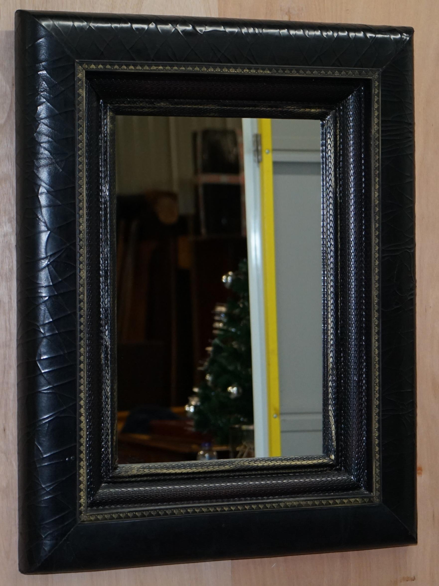 We are delighted to offer for sale this absolutely stunning Ralph Lauren black cracked leather mirror with snakeskin patina inner frame RRP £2200.

A very good looking and decorative wall mirror, I have two of these, the other is in brown leather