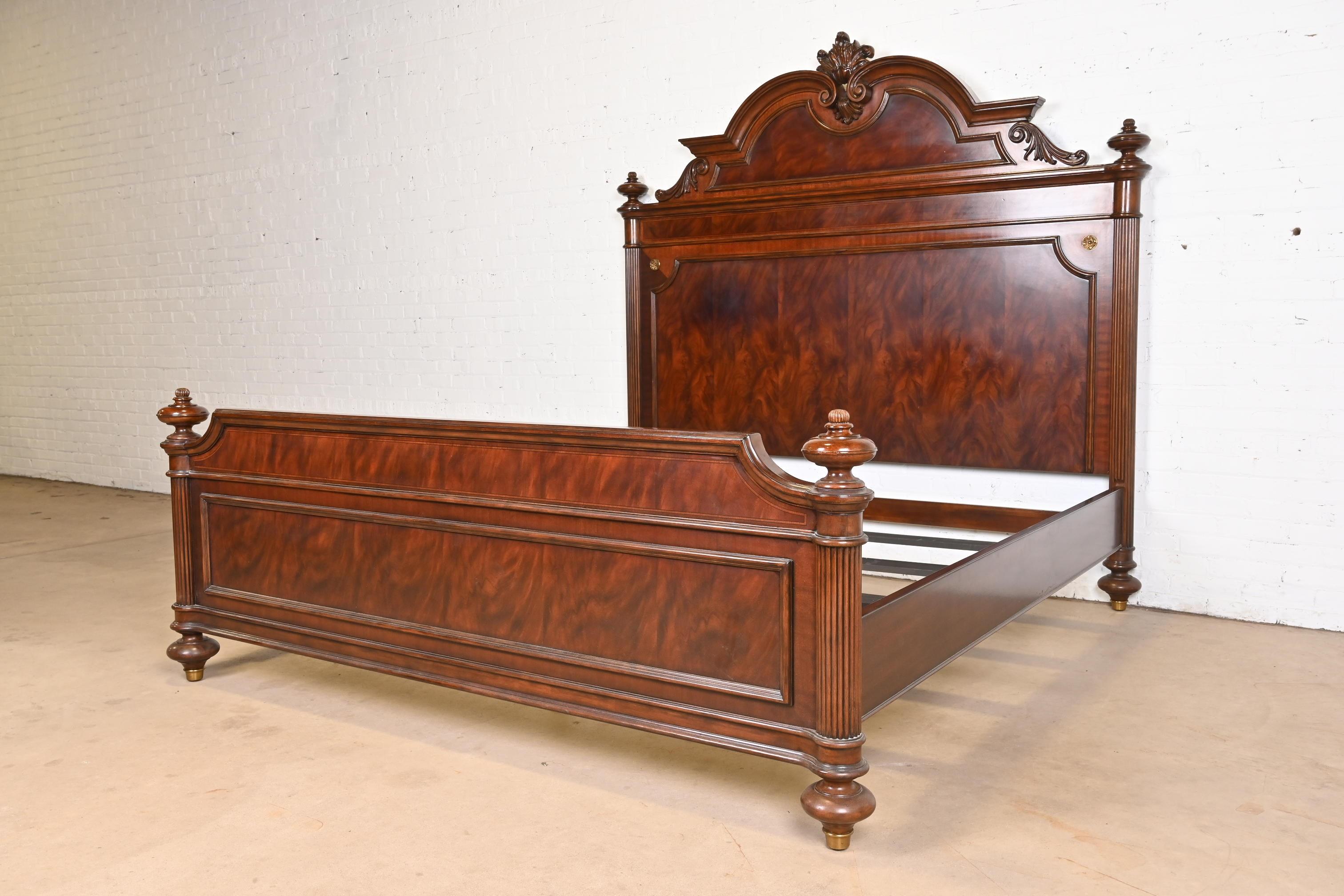 An outstanding French Empire style king size bed

In the manner of Ralph Lauren

Late 20th Century

Gorgeous flame mahogany, with carved details and brass accents.

Measures: 84