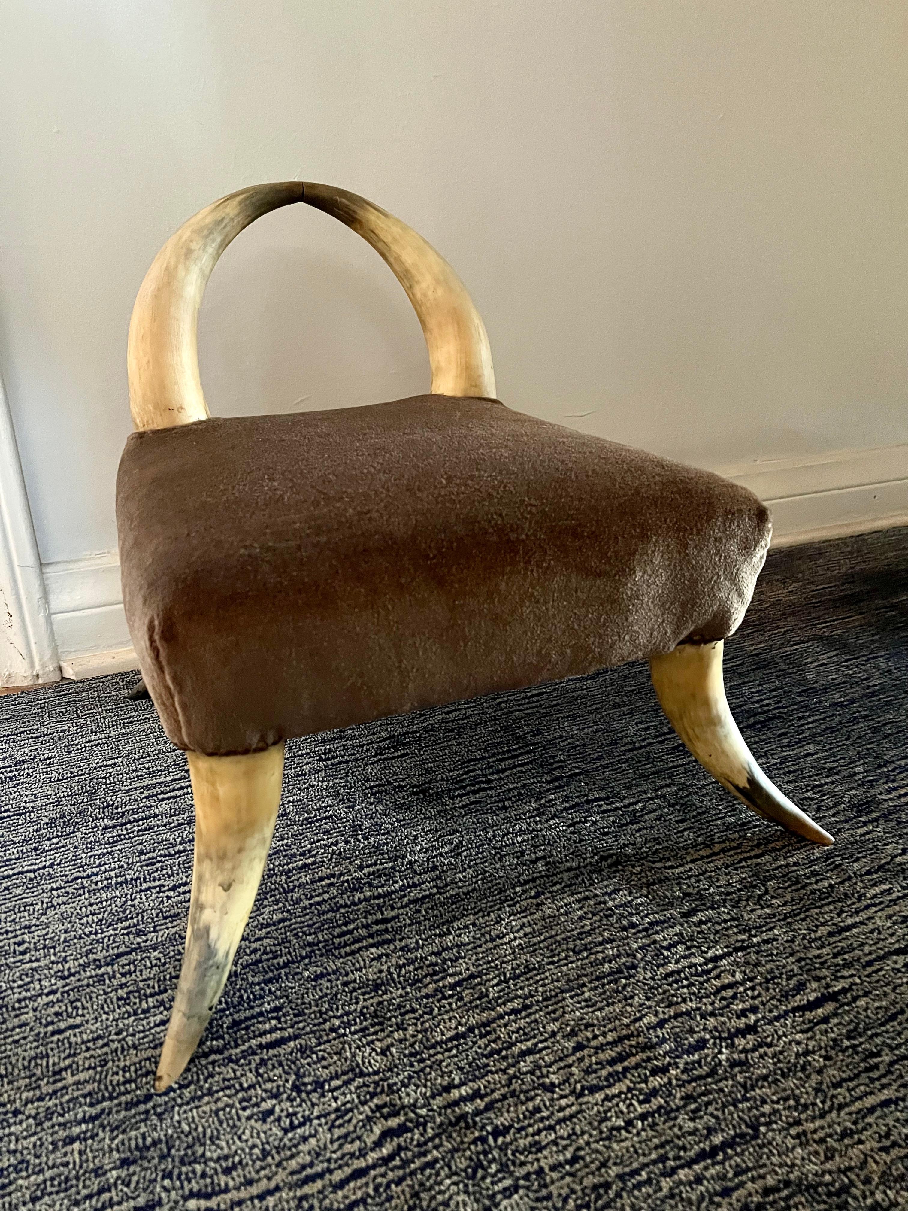 A wonderful foot stool in the style of Ralph Lauren - a compliment to any organic or natural environment and perfectly suited to rest ones weary feet. Naturally beautiful in a cabin or rustic setting.

The horn is very sturdy and in good condition
