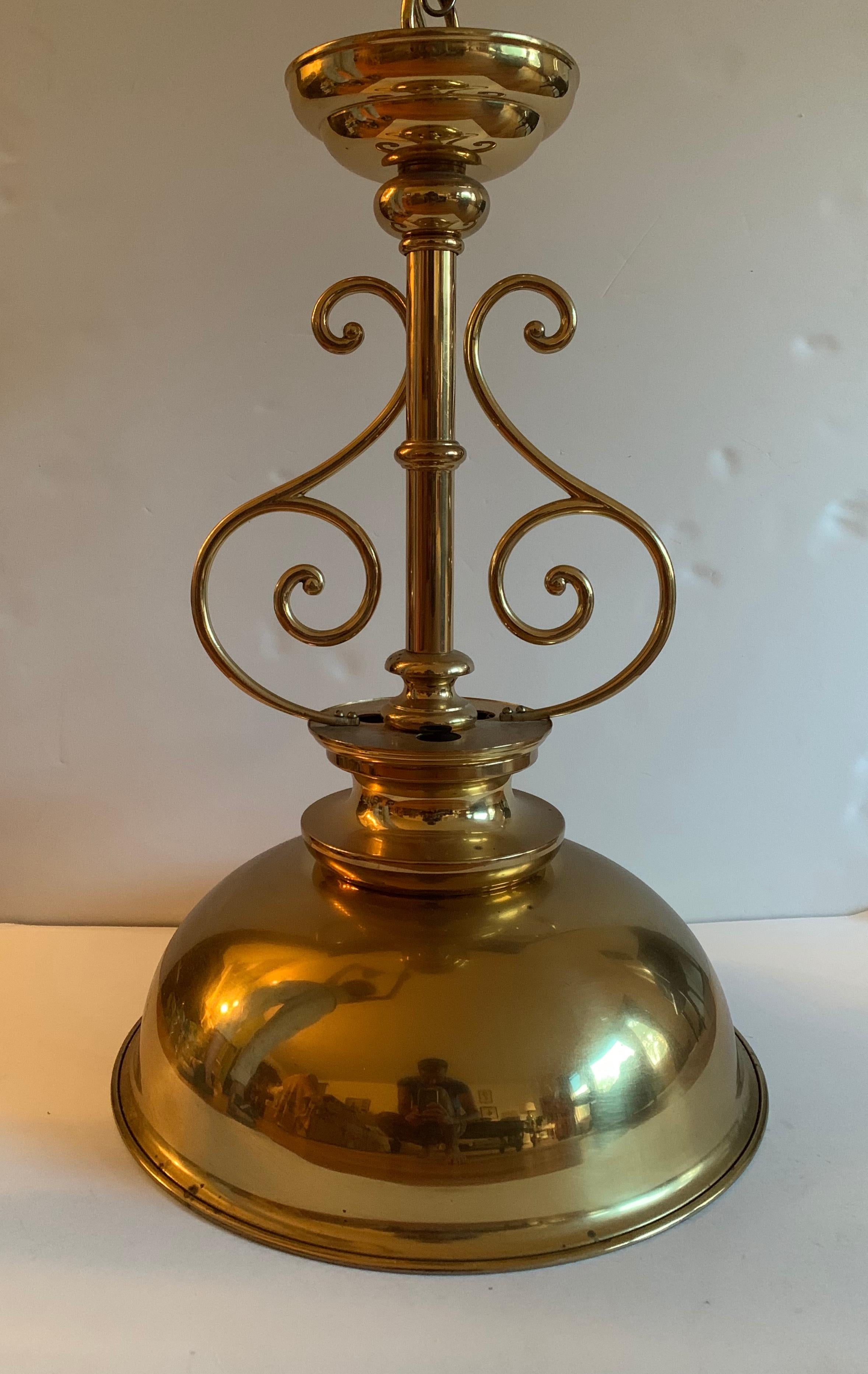 A Ralph Lauren-inspired billiard-style brass dome shade pendant light by Crystal Import Company.

Polished brass finished with white finish on shade interior.

Signed and UL listed with sticker on inside canopy.

Takes a large size US bulb;