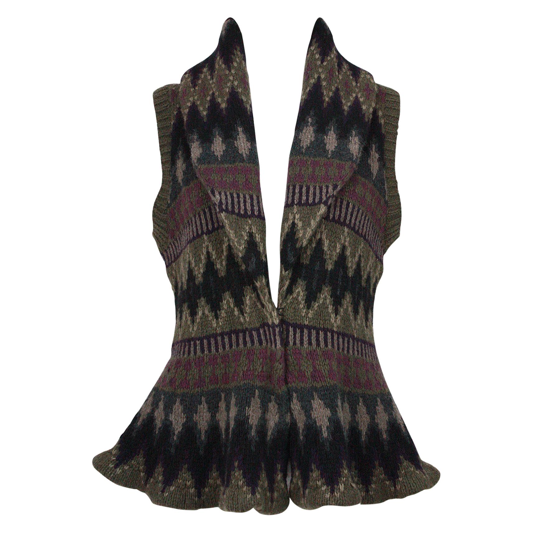 Ralph Lauren
Knit vest with peplum
Shawl collar
Soft thick weave that stretches 
Cashmere blend
Southwest pattern
Black hook and eye closures 