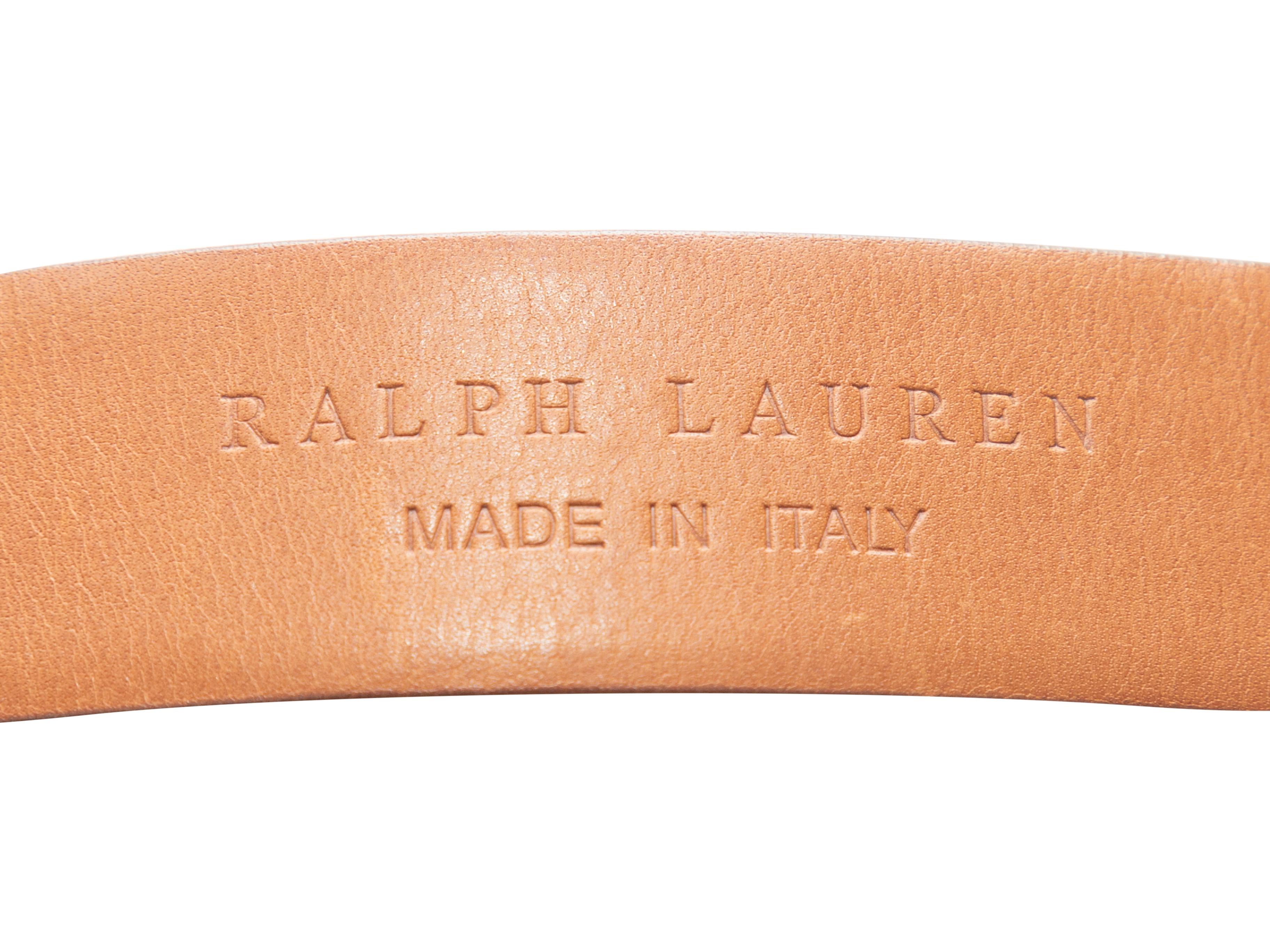 Product Details: Tan leather belt by Ralph Lauren. Large silver-tone buckle closure at front. 2