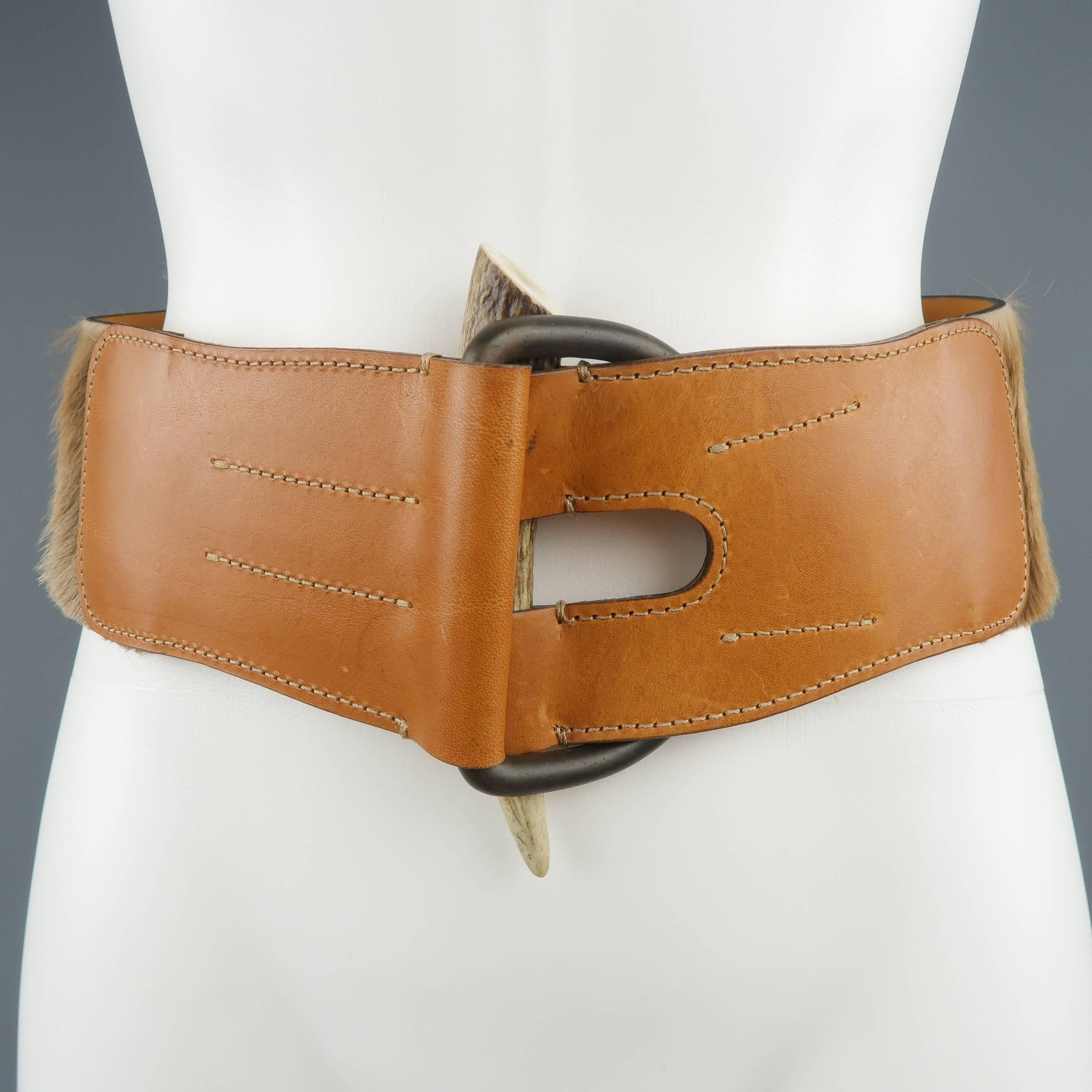 RALPH LAUREN belt features a thick beige horsehair leather strap with D loop and horn front and adjustable button stud closure back. Made in Italy.
 
Excellent Pre-Owned Condition.
Marked: M
 
Measurements:
 
Length: 38.5 in.
Width: 3 in.
Fits: