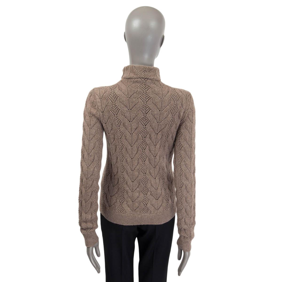 100% authentic Ralph Lauren cable knit sweater in taupe cashmere (100%). Features a high neck and long sleeves. Unlined. Has been worn and is in excellent condition.

Measurements
Tag Size	S
Size	S
Shoulder Width	40cm (15.6in)
Bust	82cm (32in) to