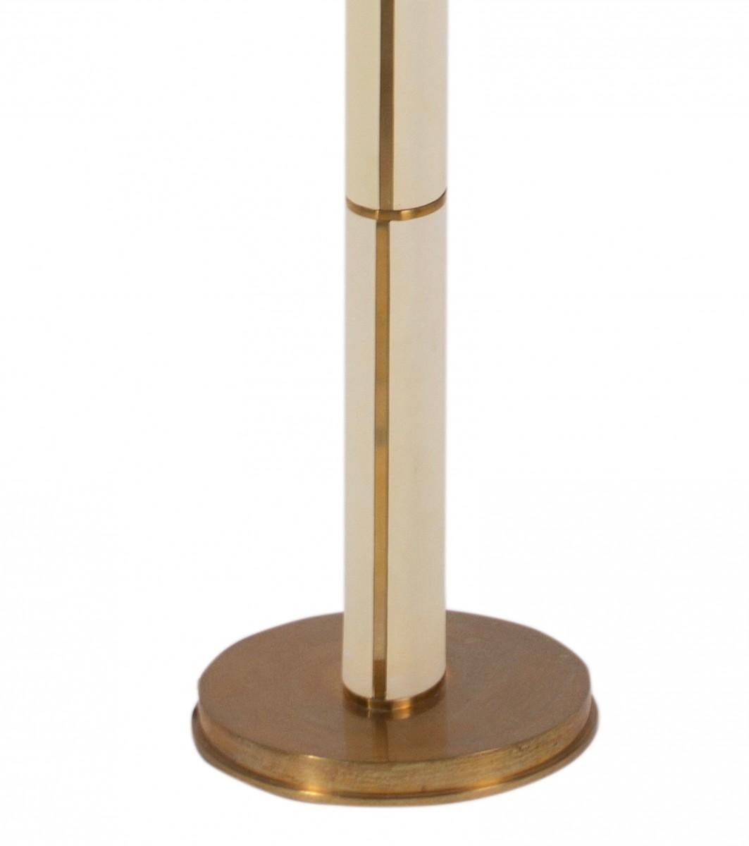 The upper fifth floor lamp by Ralph Lauren Home, circa 2000.

Featuring a parchment leather covered stem on a natural brass round base and topped with a silk shade.

Bulb: 150W A; dimmer switch; wired for US.

Dimensions: 61