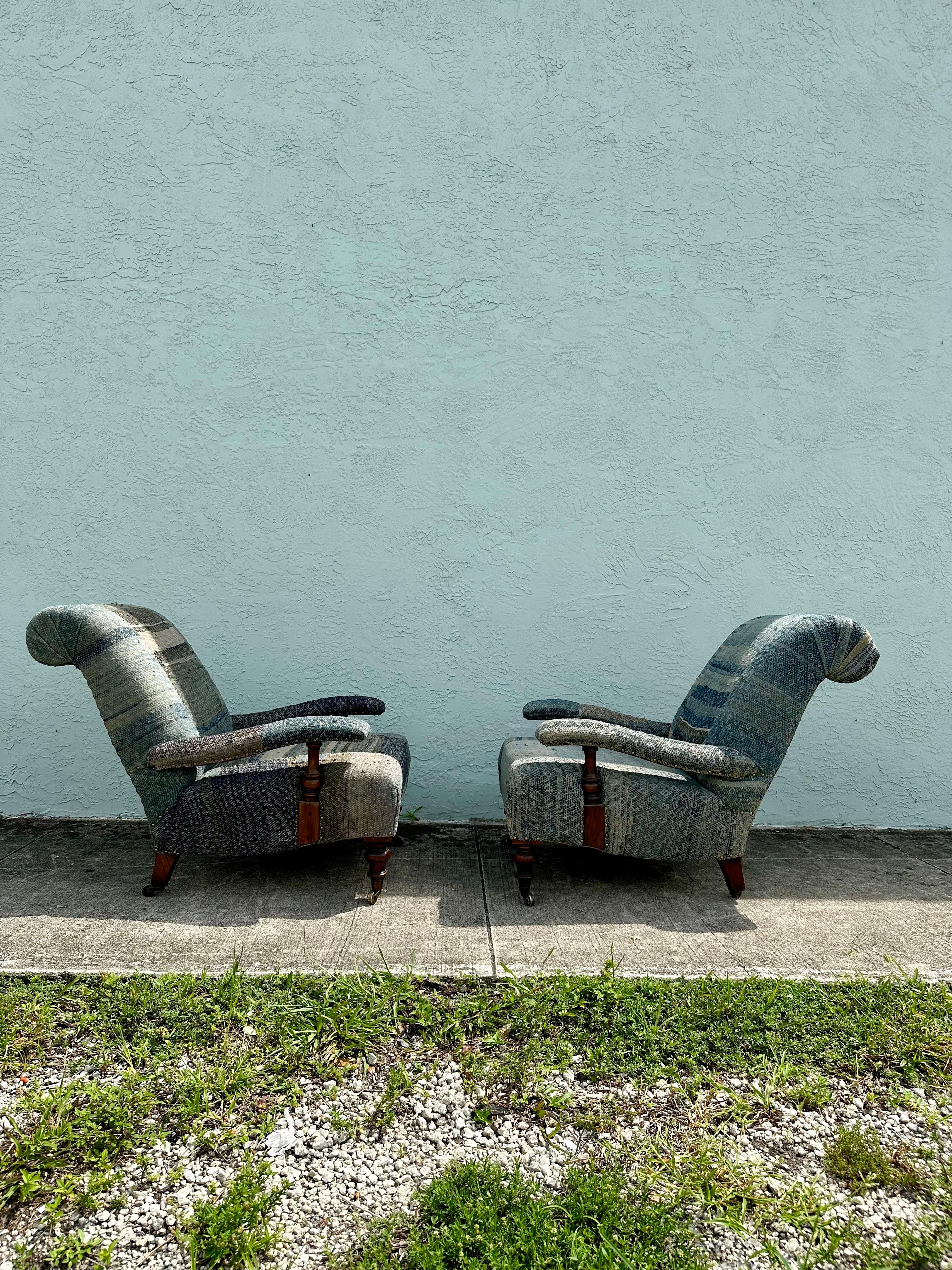 This fabulous pair of Ralph Lauren arm chairs features a durable tweedy patchwork upholstery, creating a distressed vintage look. The ultra rare chairs exudes an air of luxury and refinement. Outstanding design is exhibited throughout. The luxurious