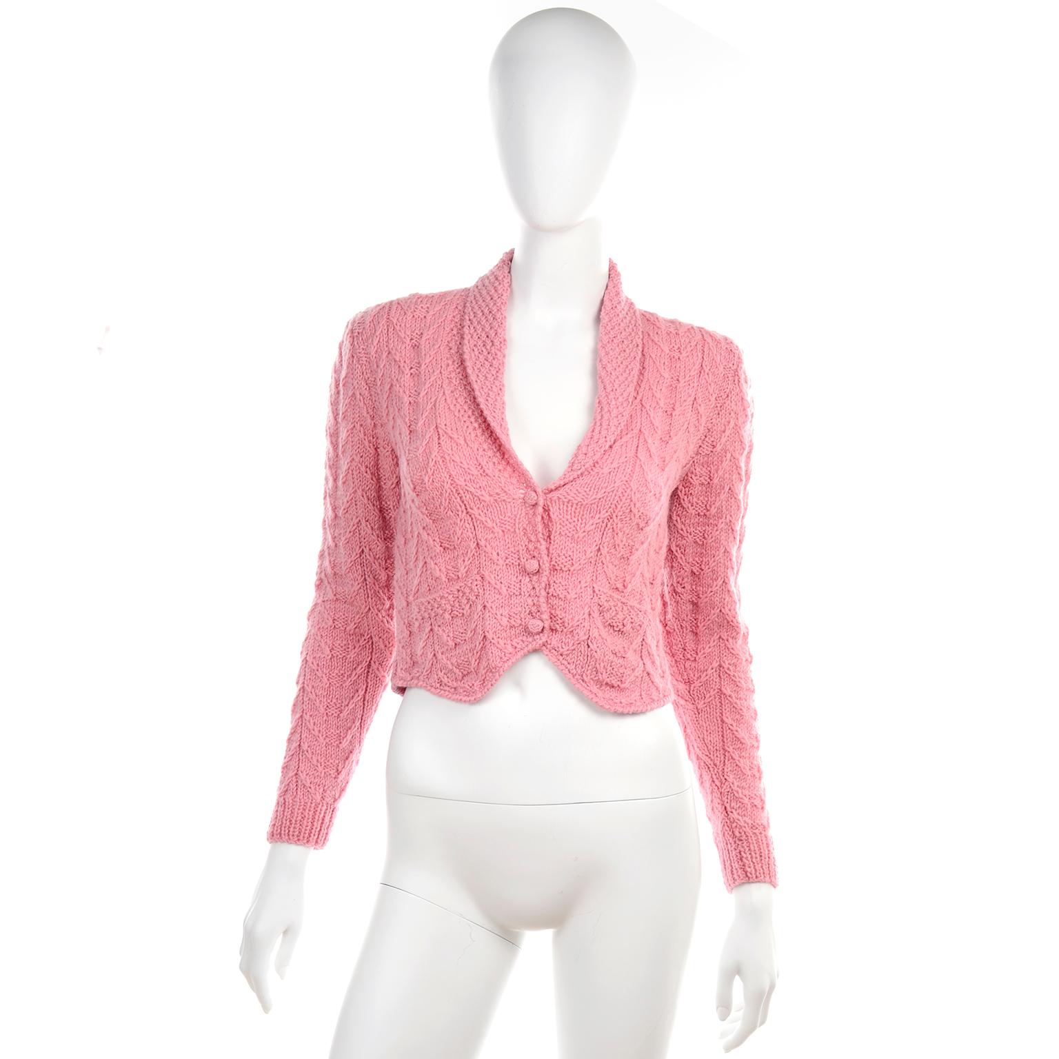 This is a beautiful vintage pink wool knit button front cardigan sweater from Ralph Lauren that is cut like a tuxedo jacket. This sweater came from one of our all time favorite estates of vintage clothing and accessories that included the best