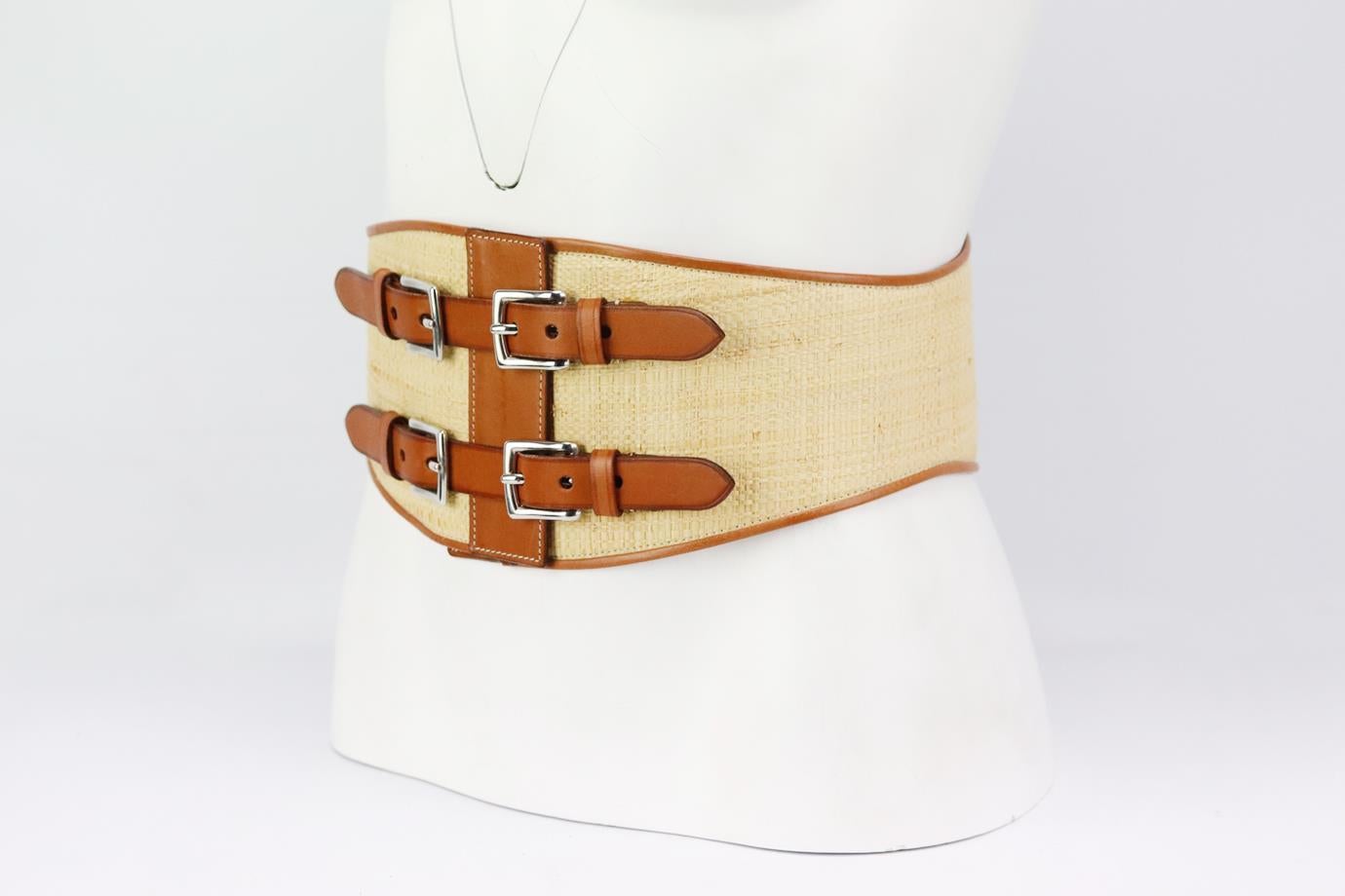 Ralph Lauren raffia and leather waist belt. Made from tan leather with beige raffia with buckle detail at the front. Tan and beige. Buckle fastening at front. Min Length: 28 in. Max Length: 30 in. Width: 5 in
