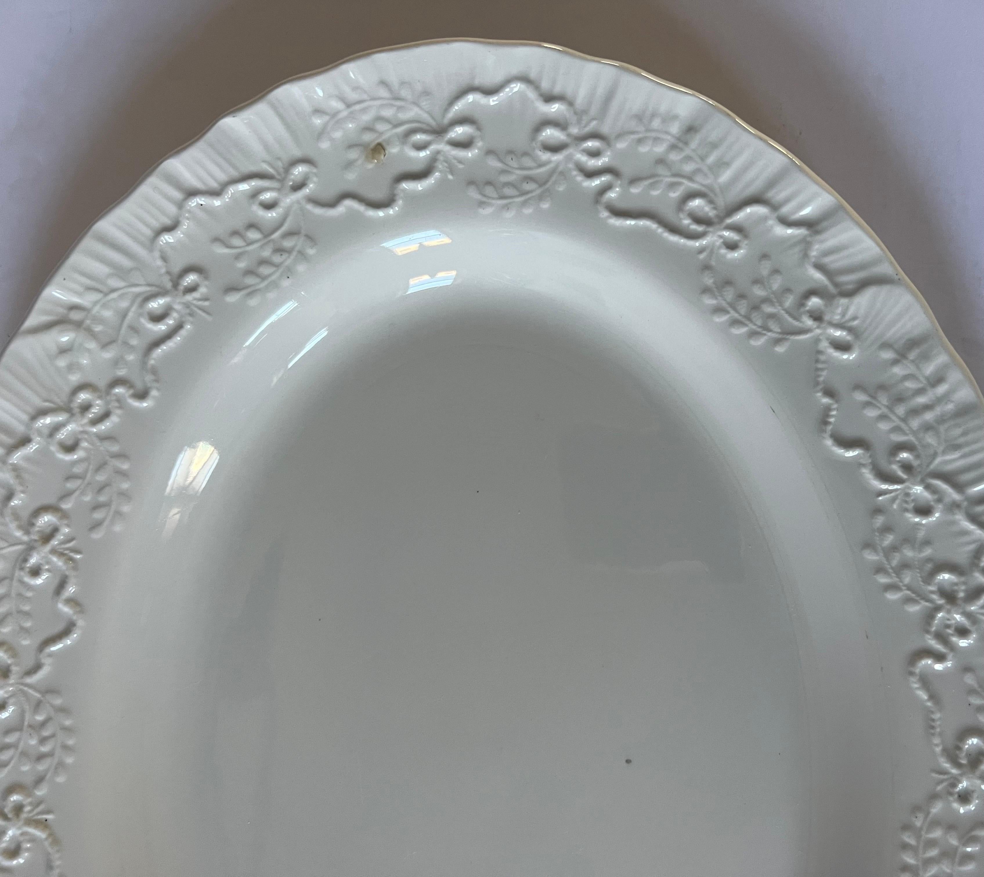 Oval serving platter in the Claire pattern by Wedgwood for Ralph Lauren Home.

Signed. Made in England, circa 1990.

Details:
*White china with an embossed design of ribbons complemented by a shell edge

*Pattern has been discontinued; actual