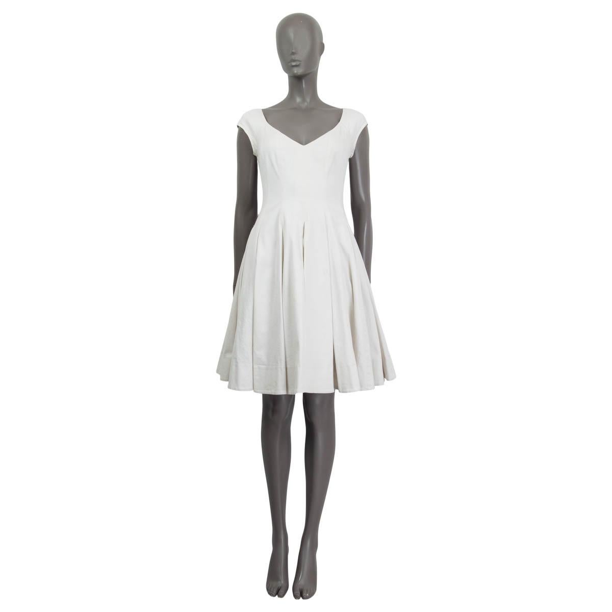 100% authentic Ralph Lauren cap sleeve pleated flared dress in white cotton (98%) and elastane (2%). Closes with a zipper on the back and is lined in white thin cotton. Has been worn and is in excellent condition. 

Measurements
Tag Size	4
Size	XS -