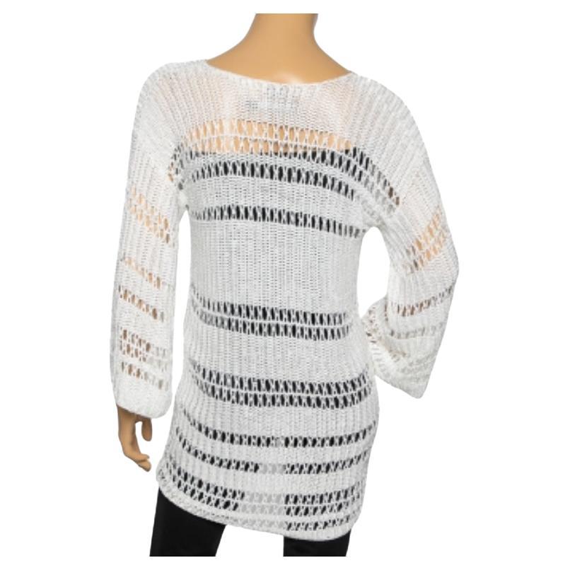 Semplice ed elegante, questo top di Ralph Lauren è l'acquisto ideale. Ha un design a maglia traforata ed è di colore bianco. Questo top a maniche lunghe può essere indossato con jeans e pantaloncini per le uscite estive!