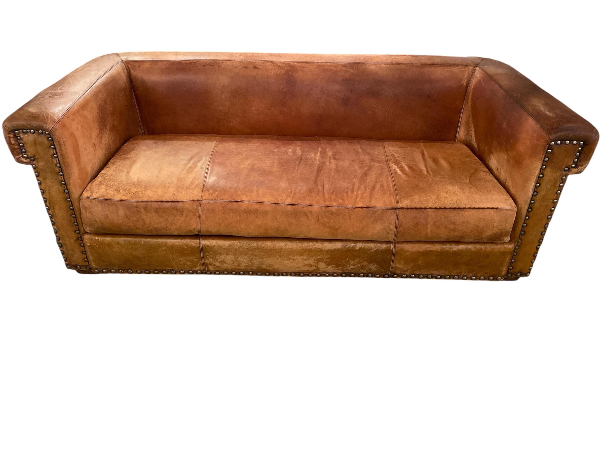 Amazing vintage sofa designed by Ralph Lauren, it has the labels on it. It is made of brown leather. It is in vintage condition, distressed. This is a really comfortable sofa. PILLOWS NOT INCLUDED