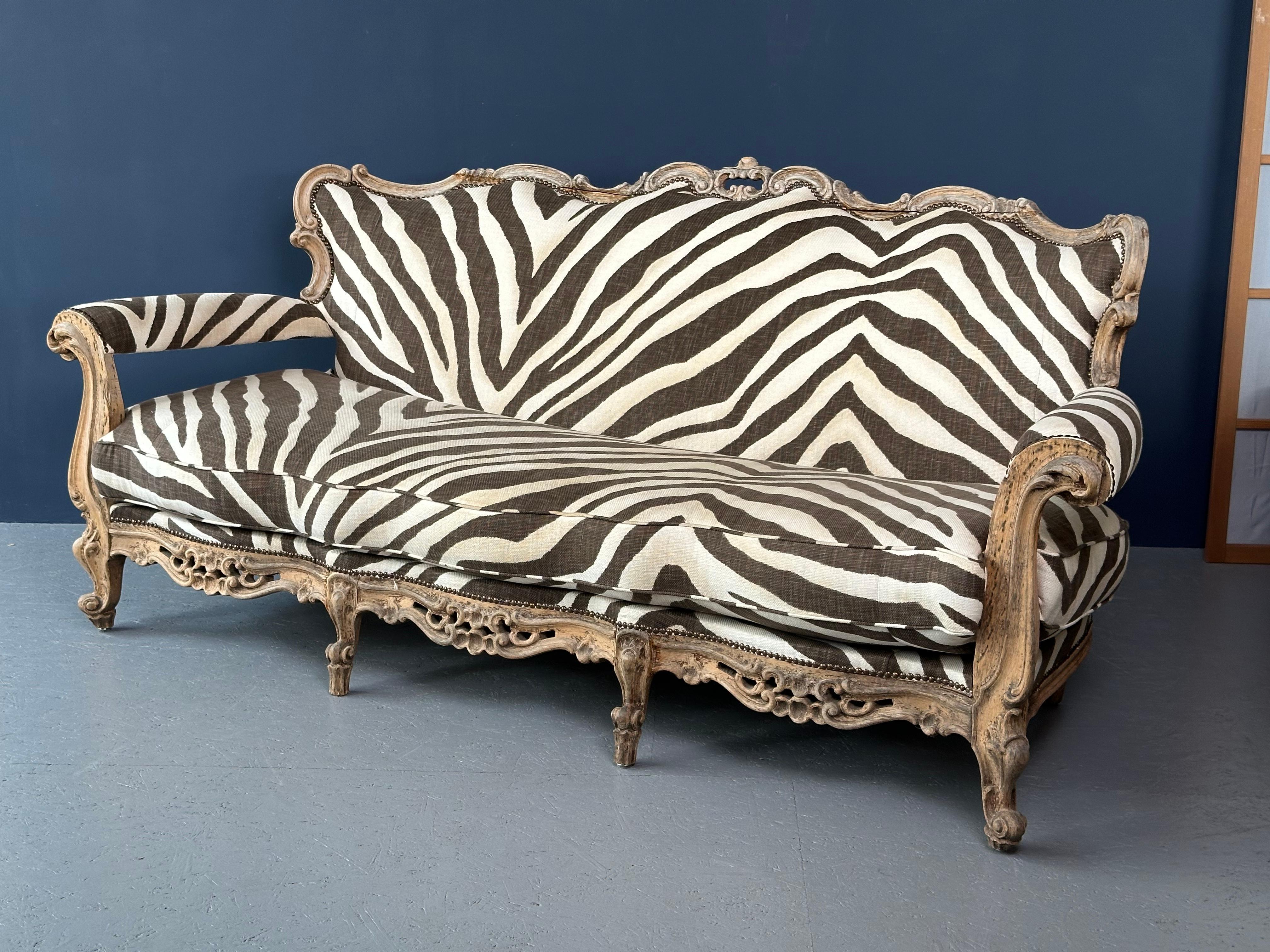 Make a bold statement with the Ralph Lauren Zebra Couch. Featuring a striking zebra print, this luxurious piece combines timeless elegance with modern flair, perfect for adding a touch of wild sophistication to your space. Seat height: 40cm