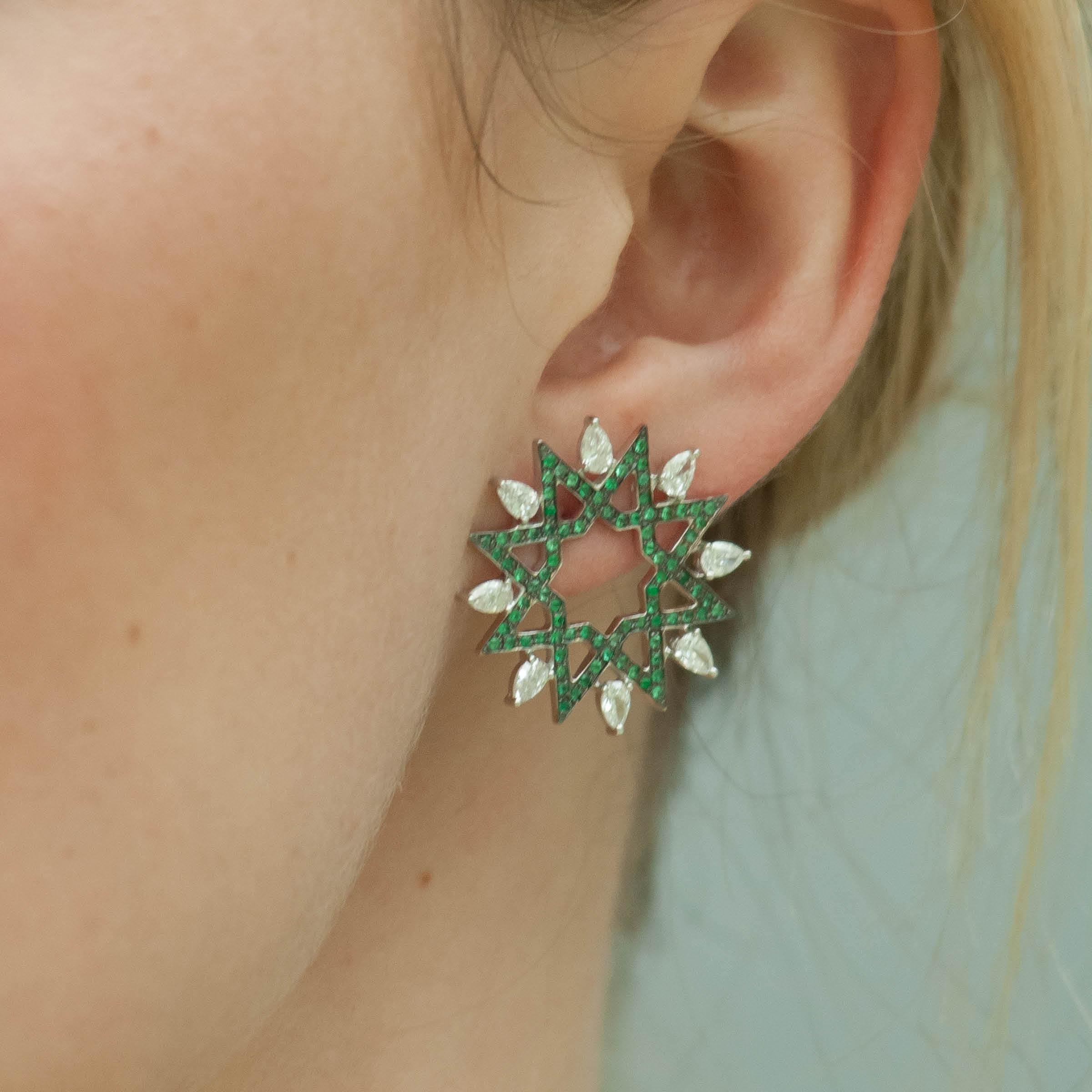 Be the star of your own show with these diamond-accented emerald sparklers, featuring Middle Eastern motifs and Art Deco elements. 

18K White Gold
Diamond TCW is 1.80
Emerald TCW is 1.60
Diameter is approx. 1 inch