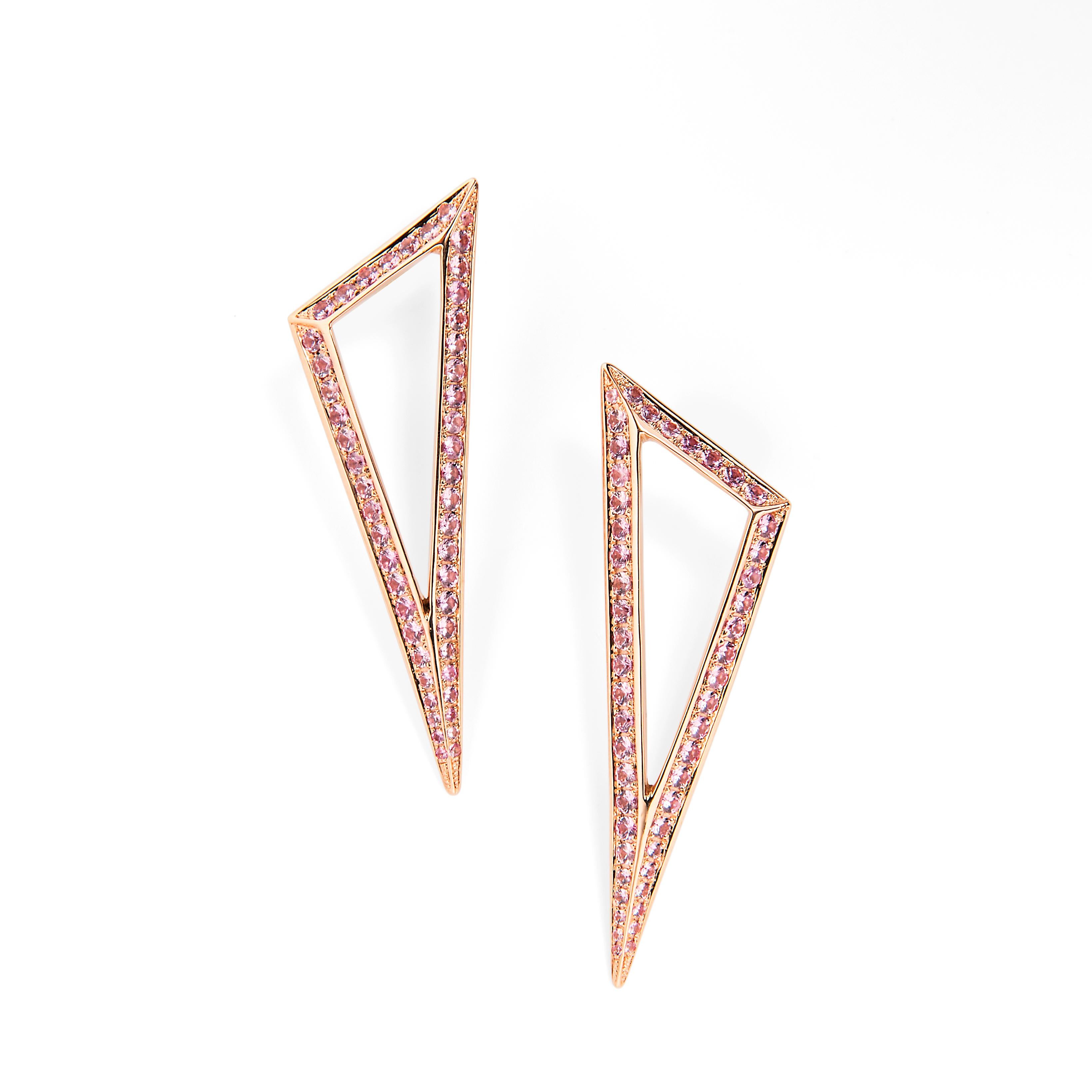 Keep your look on point with these triangle form earrings. The refined shape sparkles with elegant pink sapphires. 

18k Rose Gold
Pink sapphires TCW is 2.60
Friction post and back closure
Length is 2 inches and width is 0.65 inches
