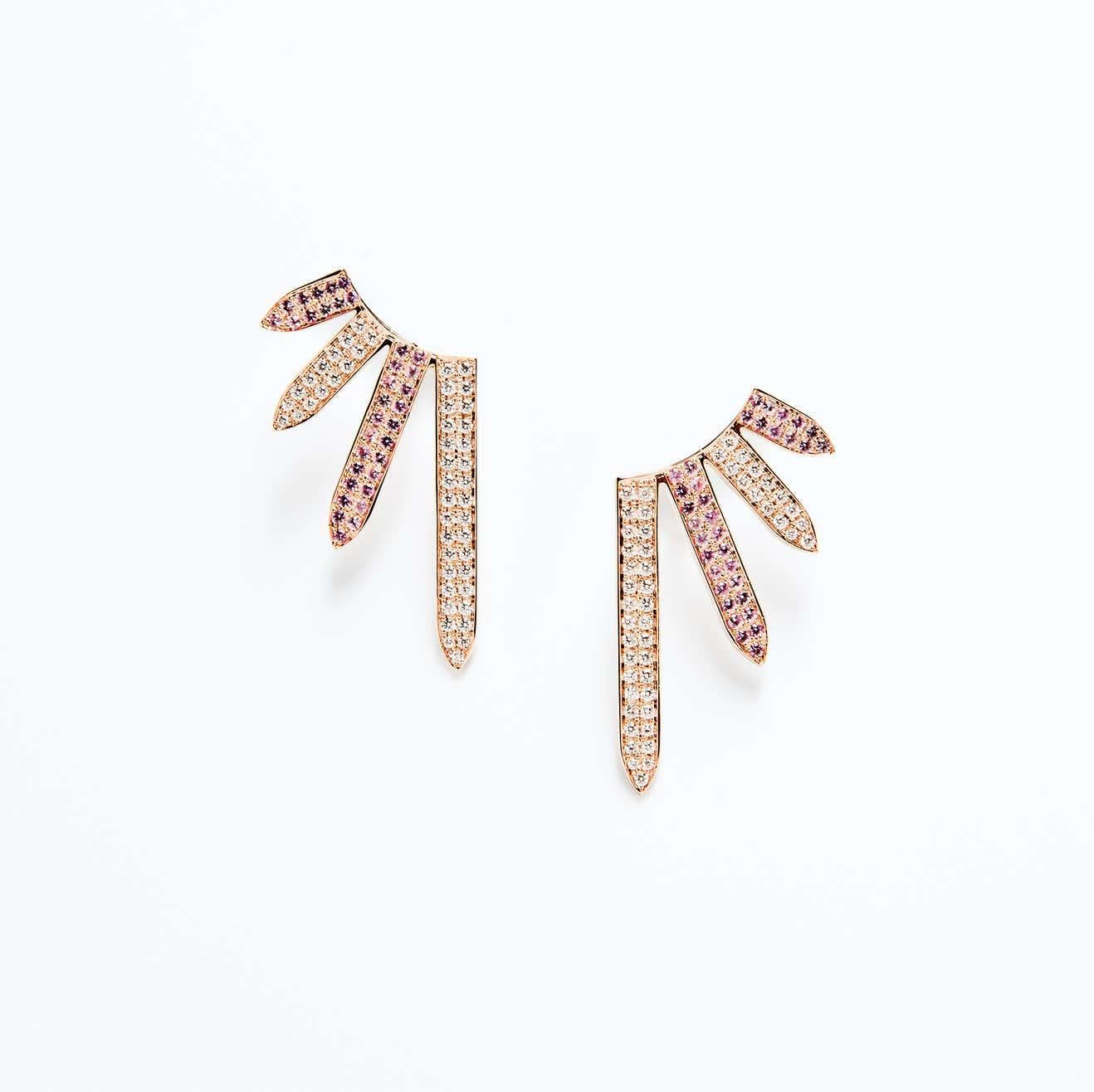Taking style cues from stained glass art, these ear climbers are a bold choice for contemporary styles.

18K Rose Gold
Diamond TCW is 0.75
Pink sapphire TCW is 0.75
Friction post and back closures
Length is 1 inch and width is 0.75 inches