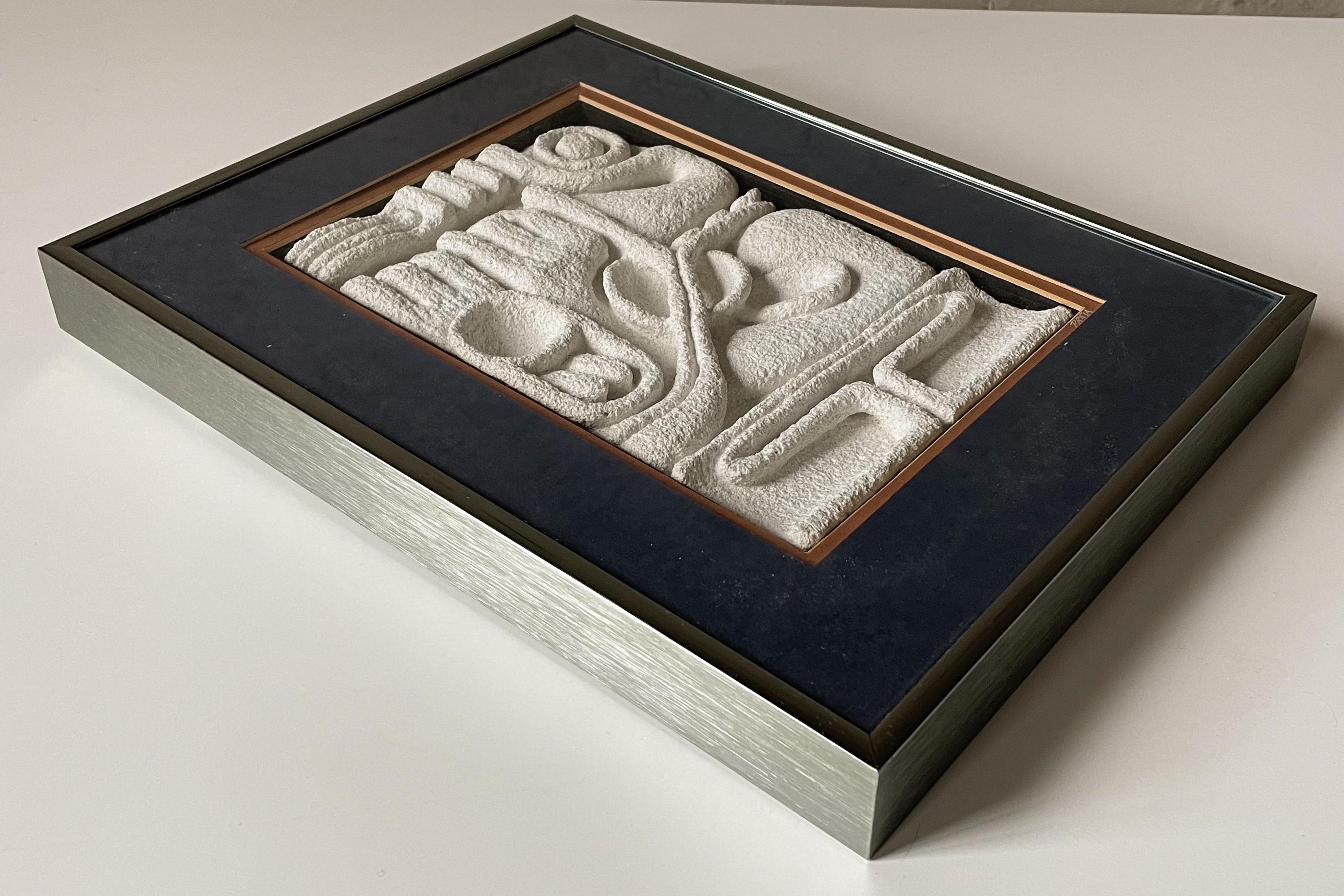 Abstract, hand-carved wall sculpture of sand, aggregates, and cement titled 