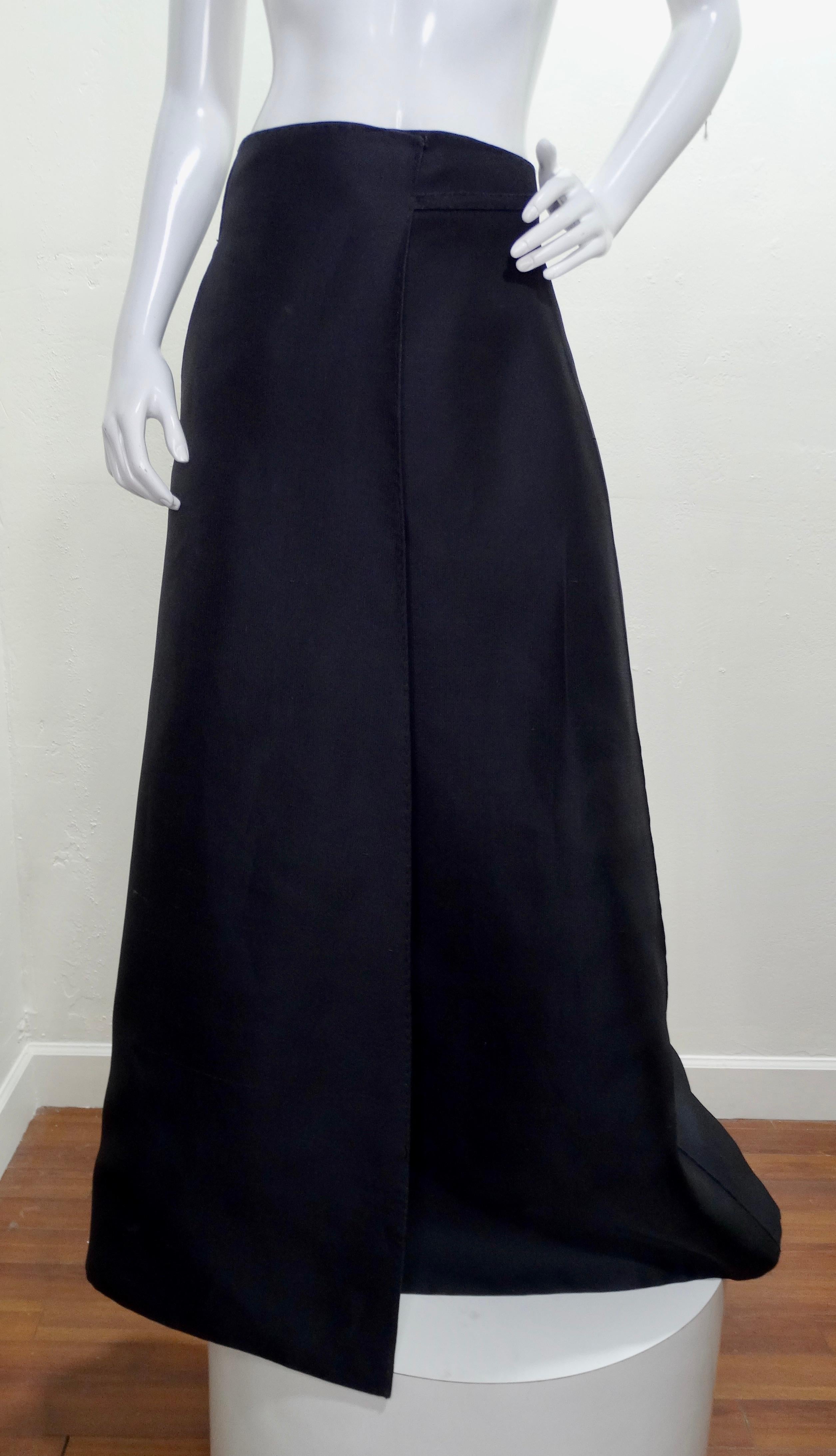 Truly a one of a kind, this custom Ralph Rucci Chado wrap skirt needs to be added to your collection! Circa 2018, this skirt features a billowy silhouette with a gorgeous black and white image of an antique vase with a tassel embellishment hanging