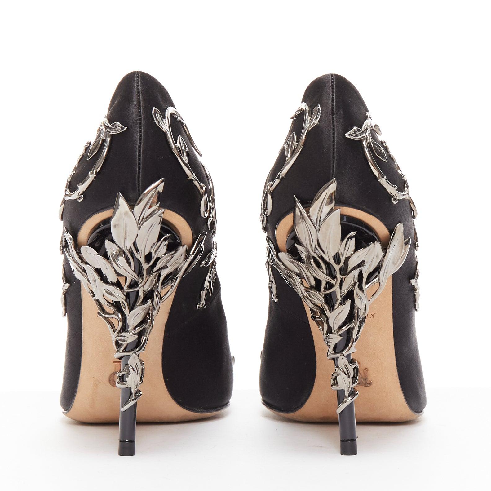 RALPH RUSSO Eden black satin gunmetal embellishments pointed pumps EU35
Reference: YIKK/A00042
Brand: Ralph Russo
Model: Eden
Material: Satin, Metal
Color: Black, Silver
Pattern: Solid
Closure: Slip On
Lining: Nude Leather
Extra Details: Leaf