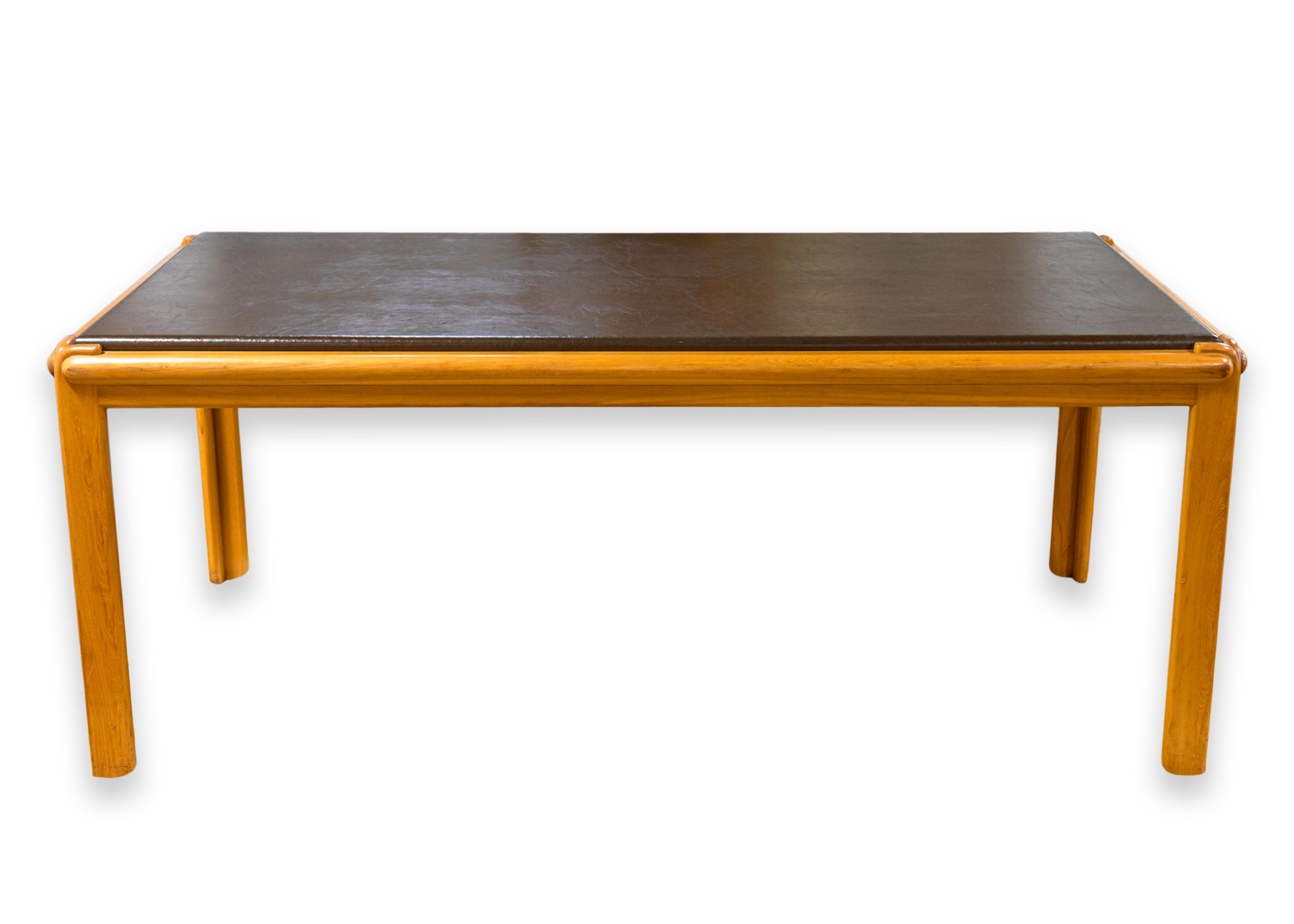 A classic minimal dining table or conference table designed by Ralph Rye Table Group for Thonet. Model 879.100 manufactured in 1977. Retains original Thonet Industries Inc. label on underside of table. Solid elm frame with deep brown vinyl top.
