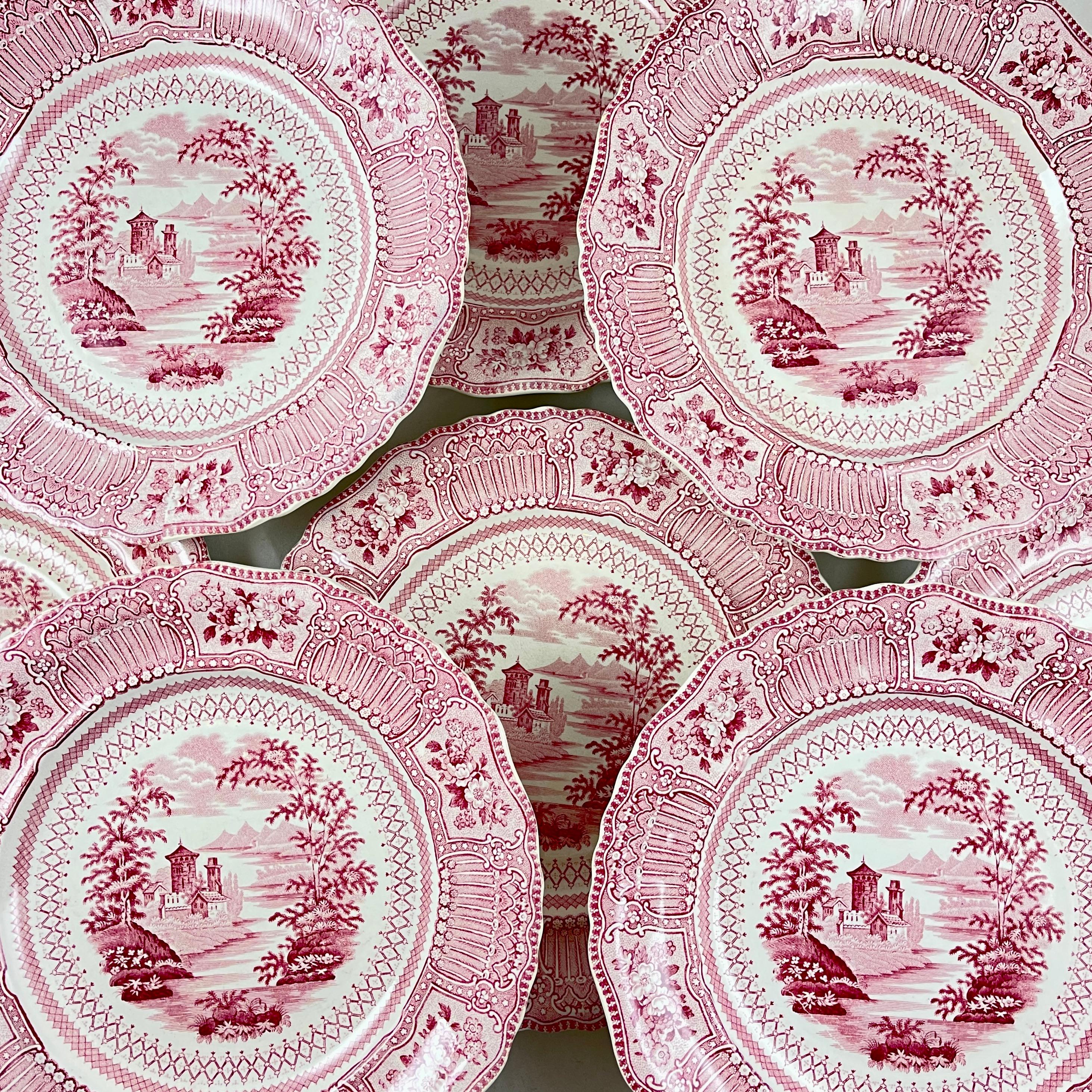 A set of eight transfer printed plates, the Cologne pattern, Ralph Stevenson & Son, Coleridge, Staffordshire England, circa 1810-1835.

A soft pink on white, the scalloped rimmed plates show a romantic landscape with a central image of a castle on