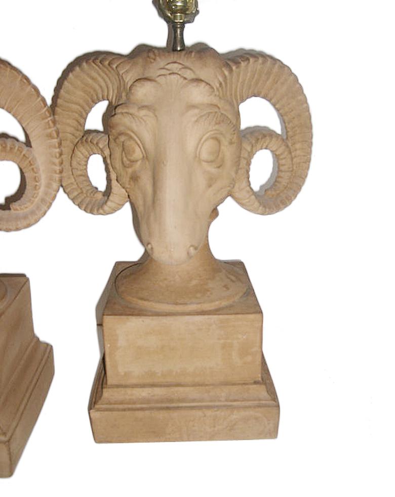 Pair of Italian figural terracotta lamps in the shape of a ram's head on square pedestal base, circa 1940s.

Measurements:
Height of body 17