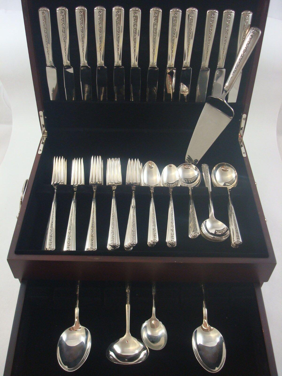 Highly polished sides with a trellis of rambling roses down the center and of the handle best describes the Rambler Rose pattern first introduced by Towle in 1937.

RAMBLER ROSE BY TOWLE sterling silver Flatware set - 65 Pieces. This set