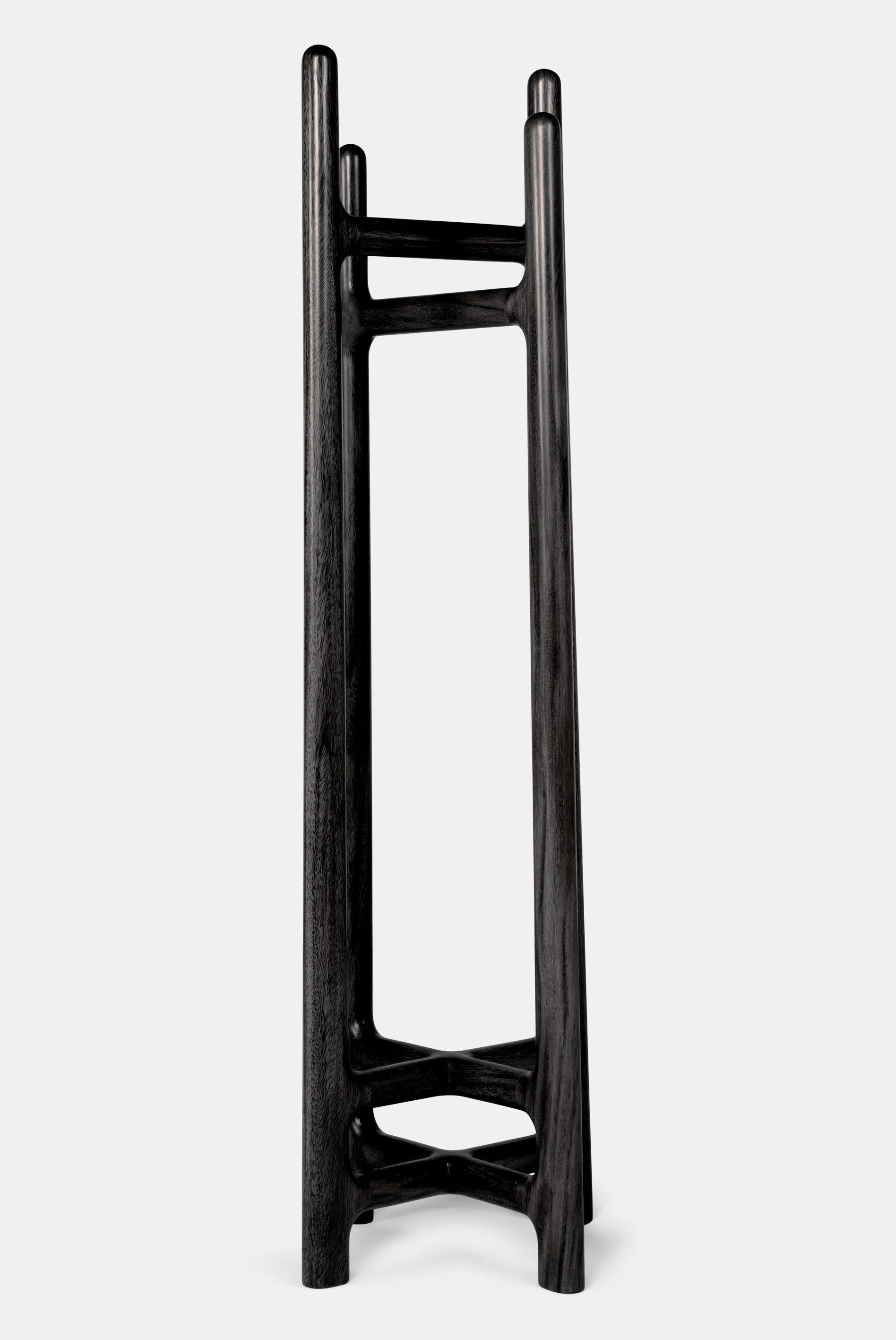 This stand-coat rack uses a contrasting intersection between its 4 legs, creating a unique and dynamic look that combined with premium solid hardwood makes a distinctive, elegant rack that will set the tone of your home when it’s in use or not.