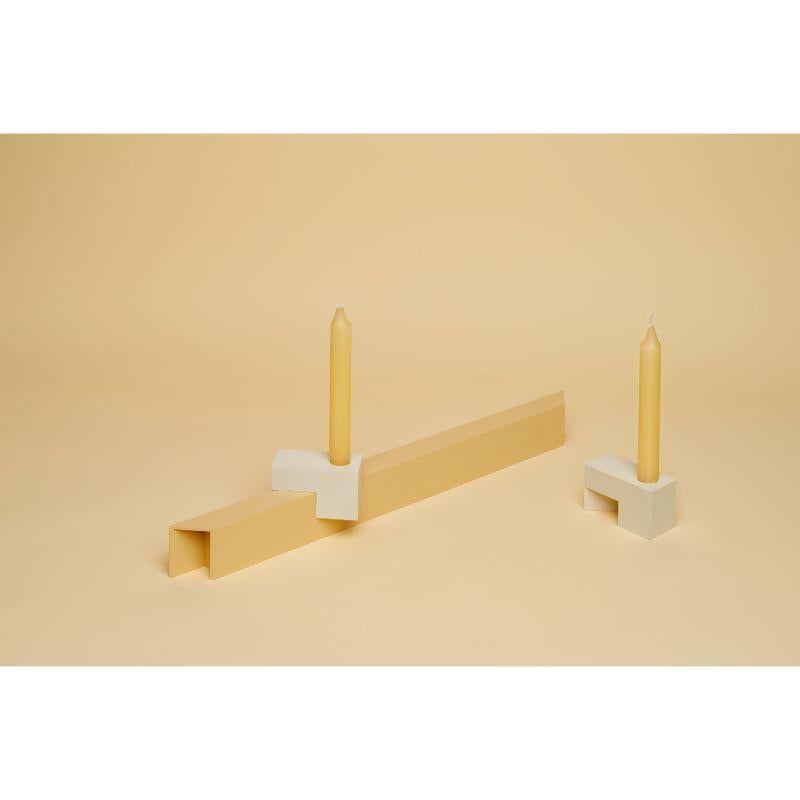 Ramo candelabra by Atelier Ferraro
Dimensions: 43 x 3 x H 5 (Base), L 8 x W 4 x H 5 (Candle Holder)
Materials: Recycled Aluminum

The idea for the candleholder “RAMO” was born at a dinner with friends, after which everyone took a candle from the