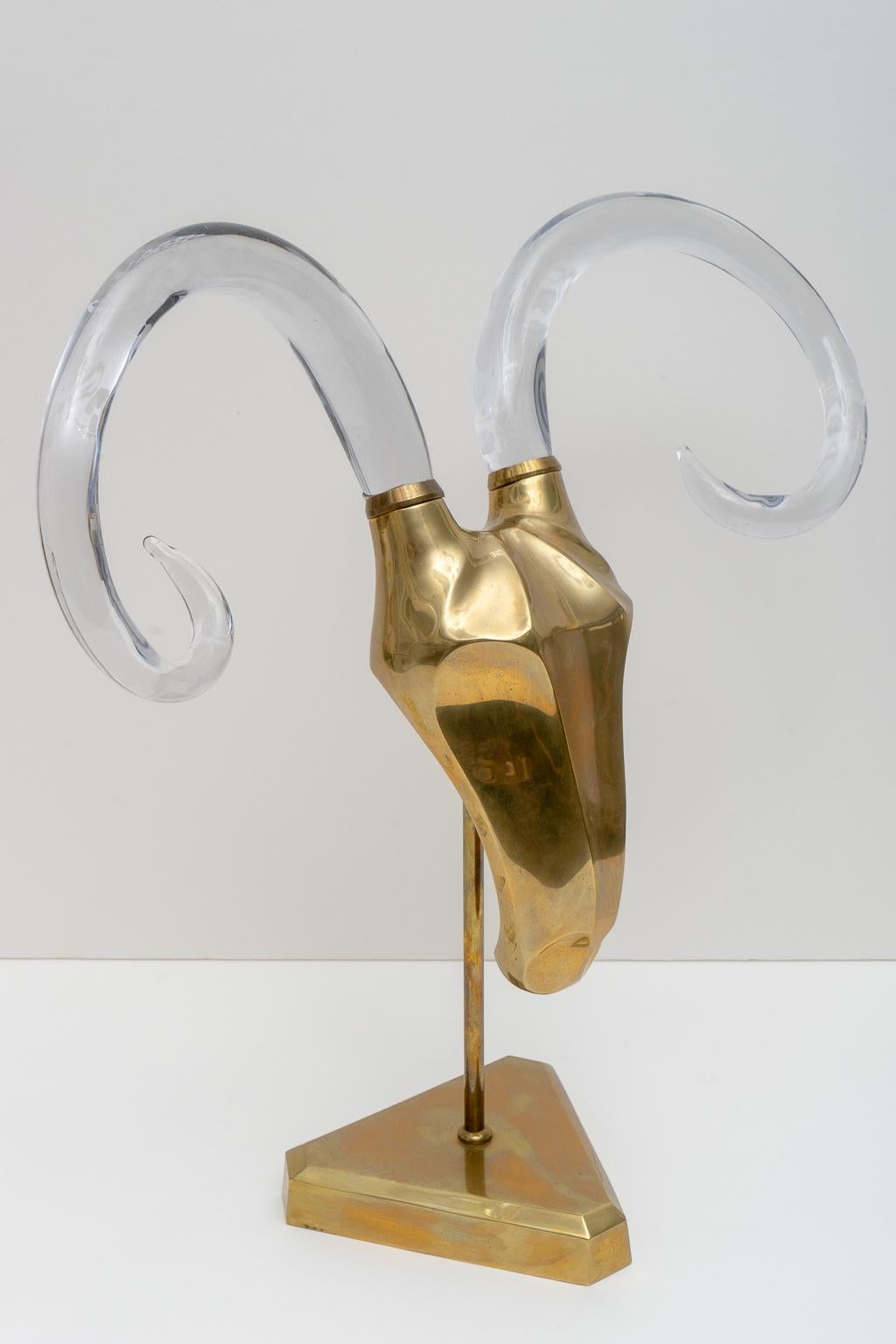 This stylish and chic figure of a stylized rams head is fabricated in brass and Murano Glass and was acquired from a Palm Beach estate. The piece is attributed to Karl Springer and dates to the late 1970s-1980s.