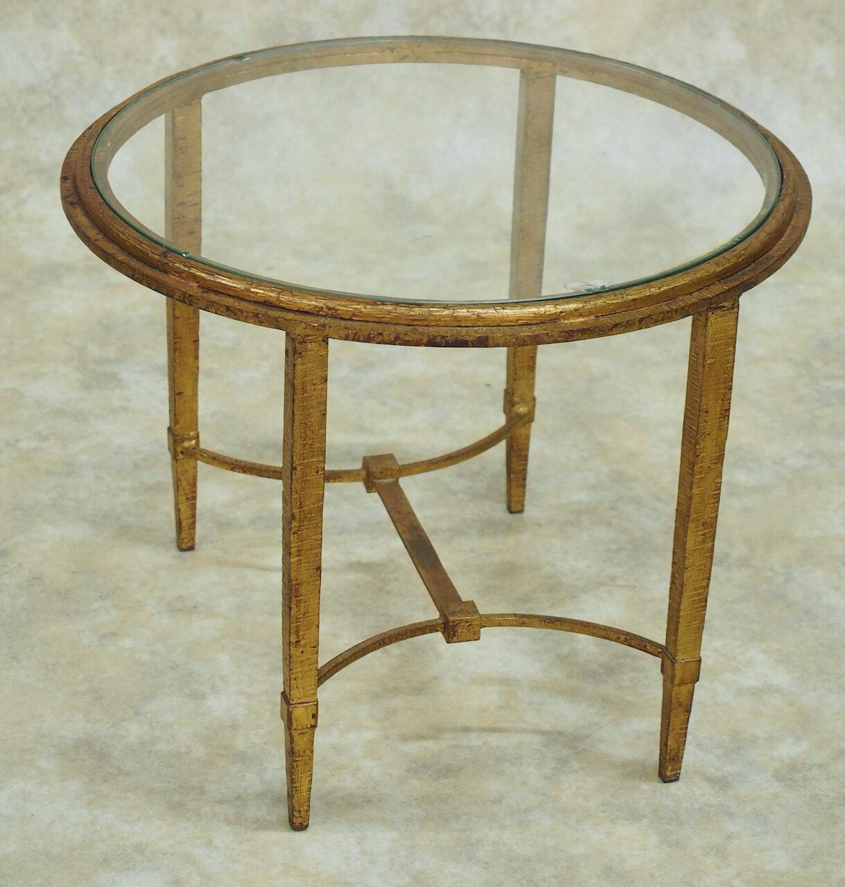 French Forties Art Deco low round side table in gilt forged iron by Ramsay. 22” diameter x 17” high. 

Ramsay (Maison Ramsay)

French 20th century design house which produced a variety of furniture including gilt forged iron, and bronze.
  