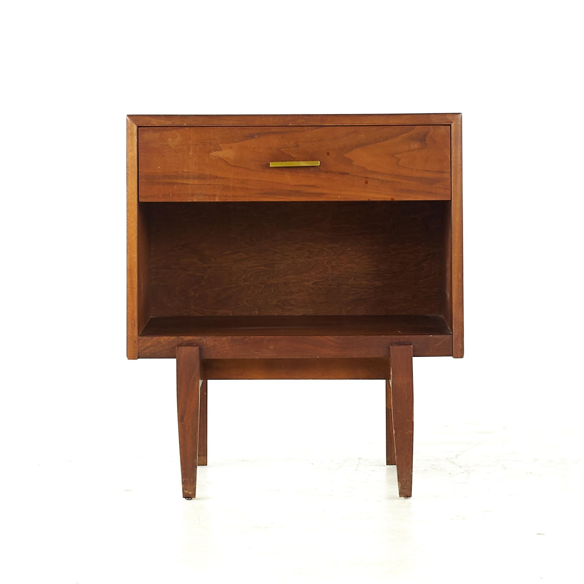 Ramseur midcentury Walnut and Brass Nightstand

This nightstand measures: 22 wide x 16 deep x 25.25 inches high

All pieces of furniture can be had in what we call restored vintage condition. That means the piece is restored upon purchase so