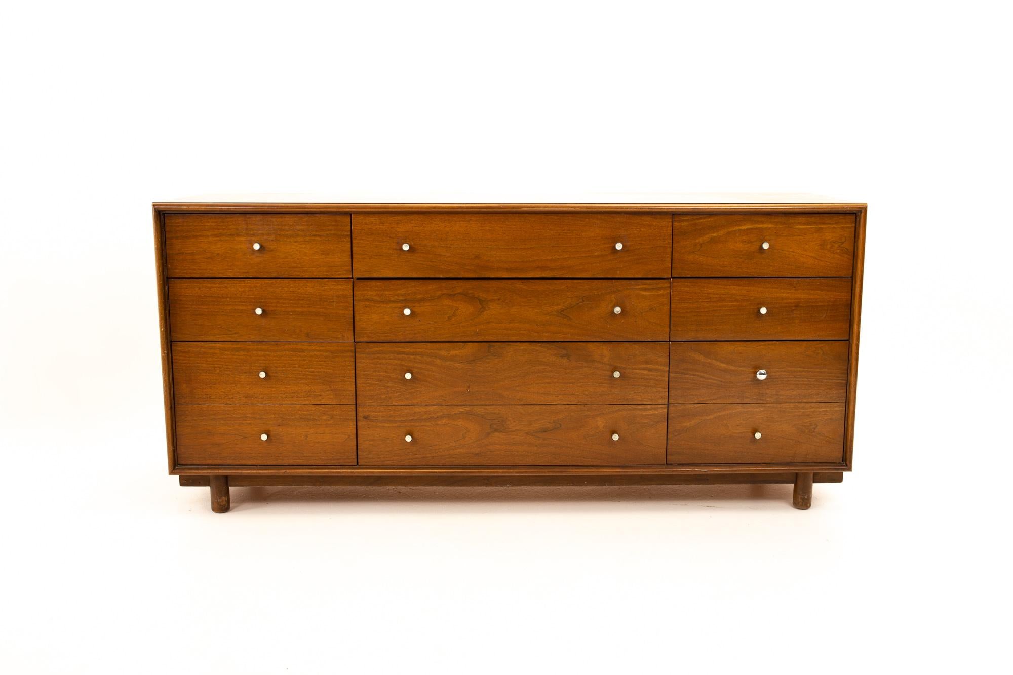 Ramseur Mid Century walnut 12-drawer lowboy dresser
Dresser measures: 66.5 wide x 19.5 deep x 30.5 high

All pieces of furniture can be had in what we call restored vintage condition. That means the piece is restored upon purchase so it’s free of