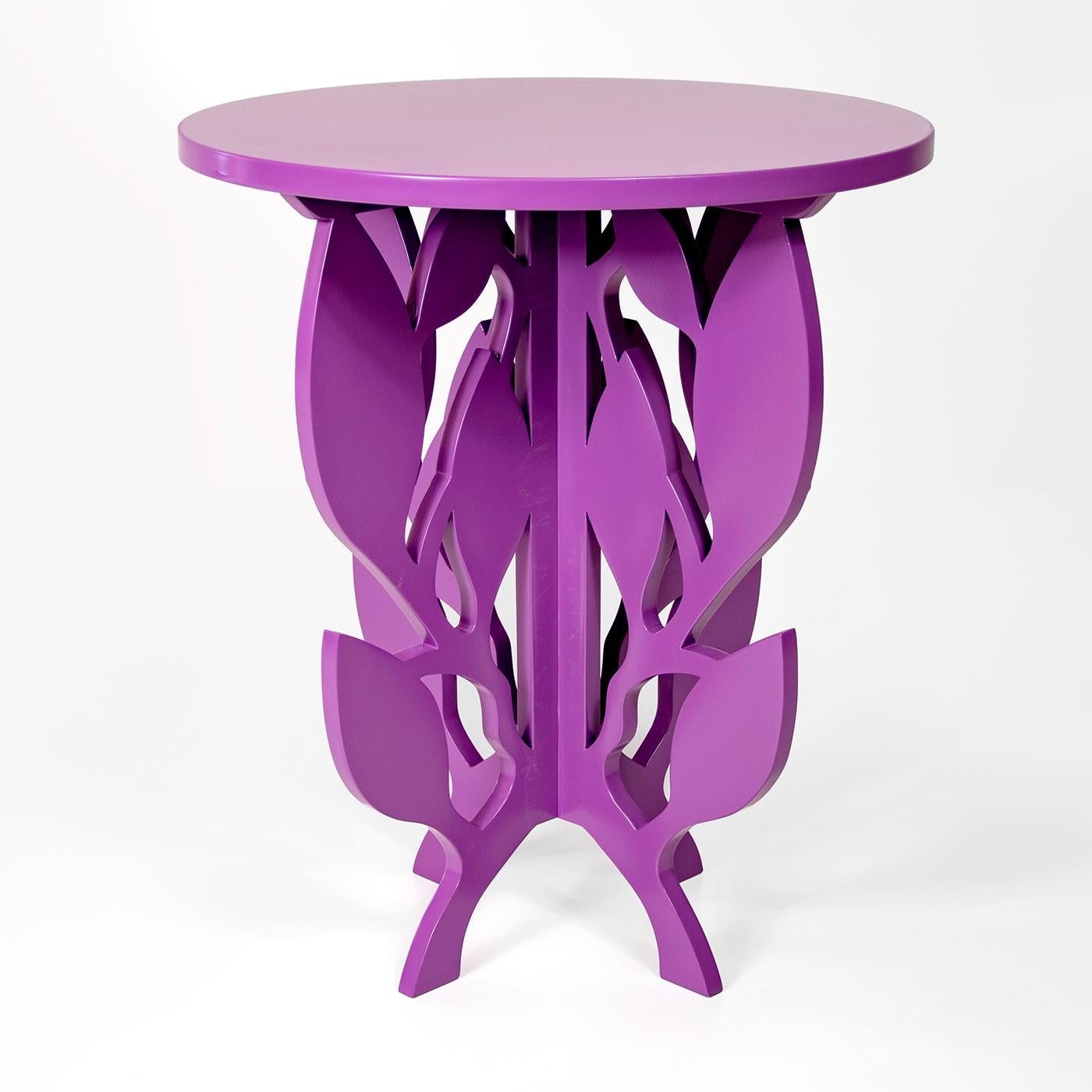 This charming side table immediately conjures the image of romantic elegance, adding an upscale touch to an eclectic living room or a vintage-inspired bedroom. Handcrafted entirely of wood finished in a captivating matte purple, the leaf motif of