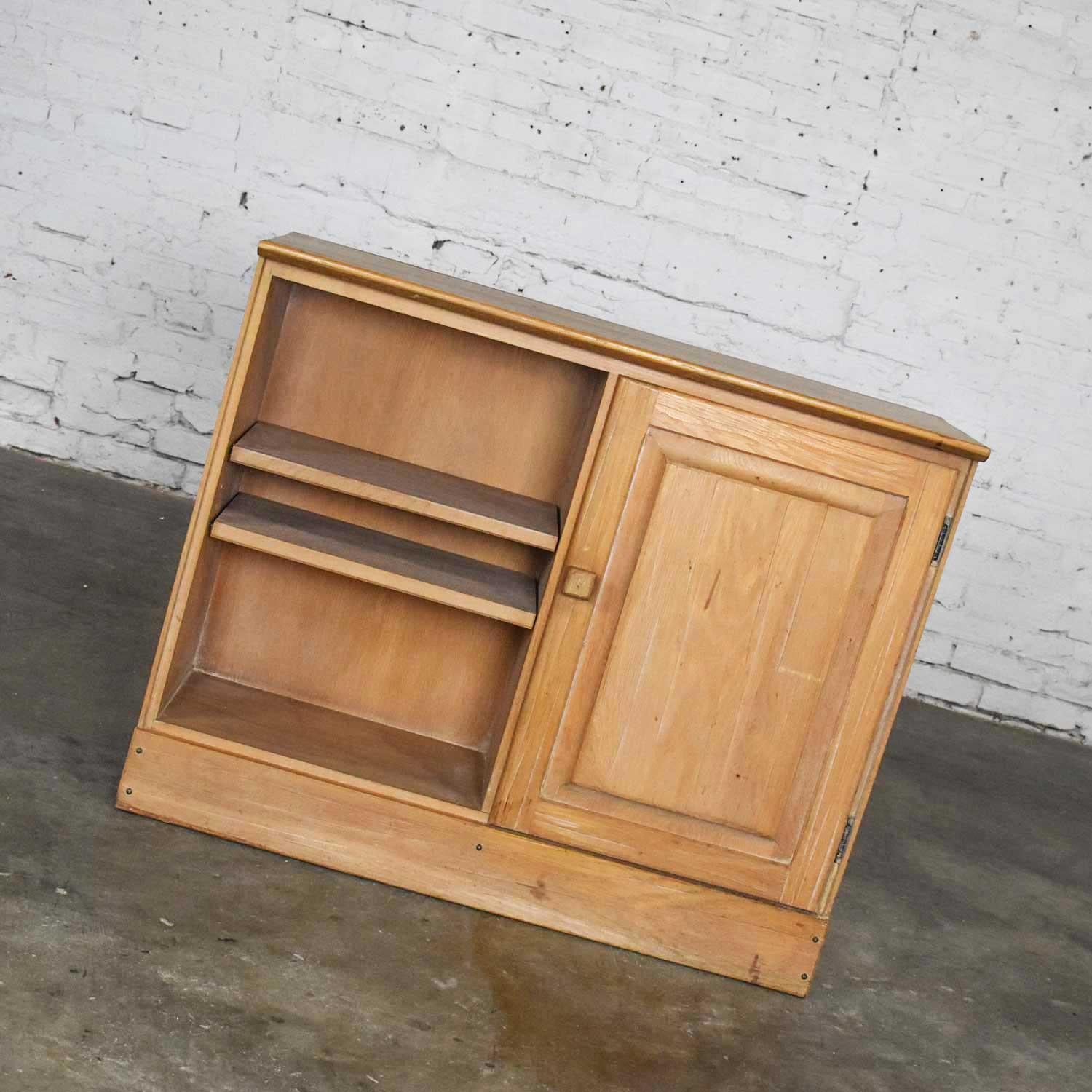 Awesome small credenza, end table cabinet, or nightstand by A. Brandt comprised of solid ranch oak with natural oak finish. Wonderful vintage condition. Some use and wear marks show on the top surface. Please see photos, Circa mid-20th