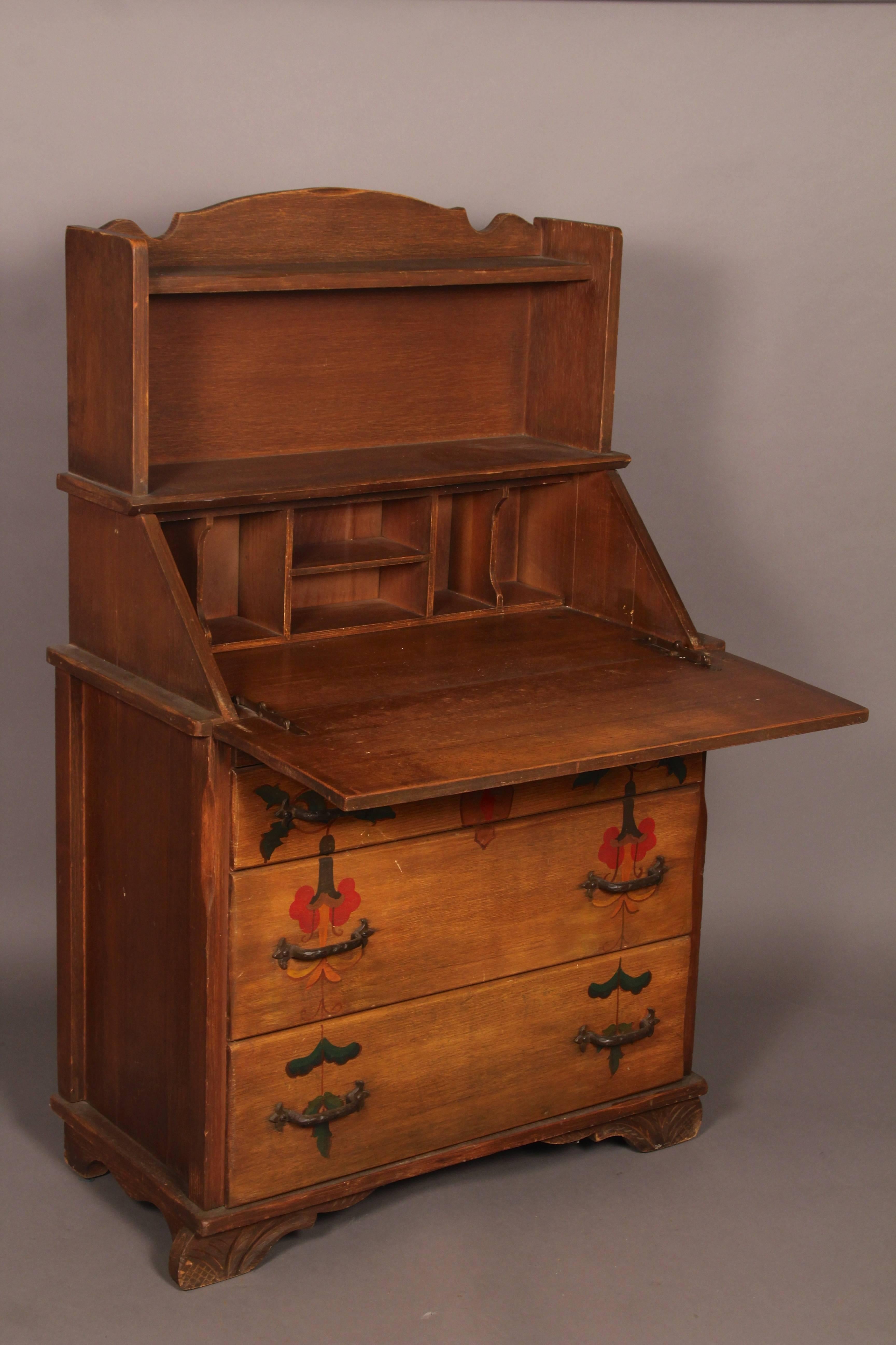 Very practical secretary desk with fold down desktop. Three drawers. Original finish. Unsigned, circa 1930s.