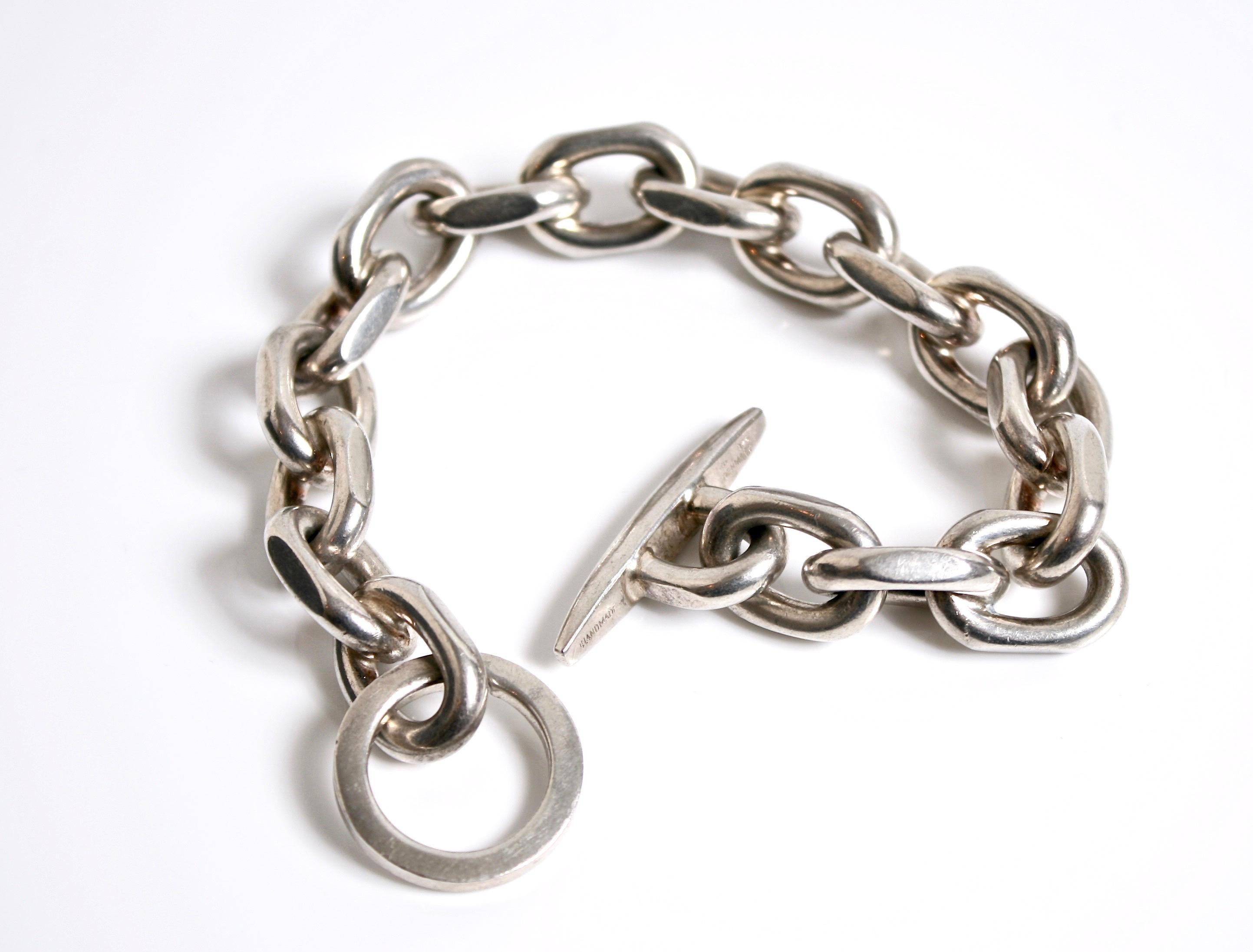 Heavy link sterling silver hand made chain bracelet designed by Randers Denmark c.1970 signed RS Denmark
Squared links with large O ring

