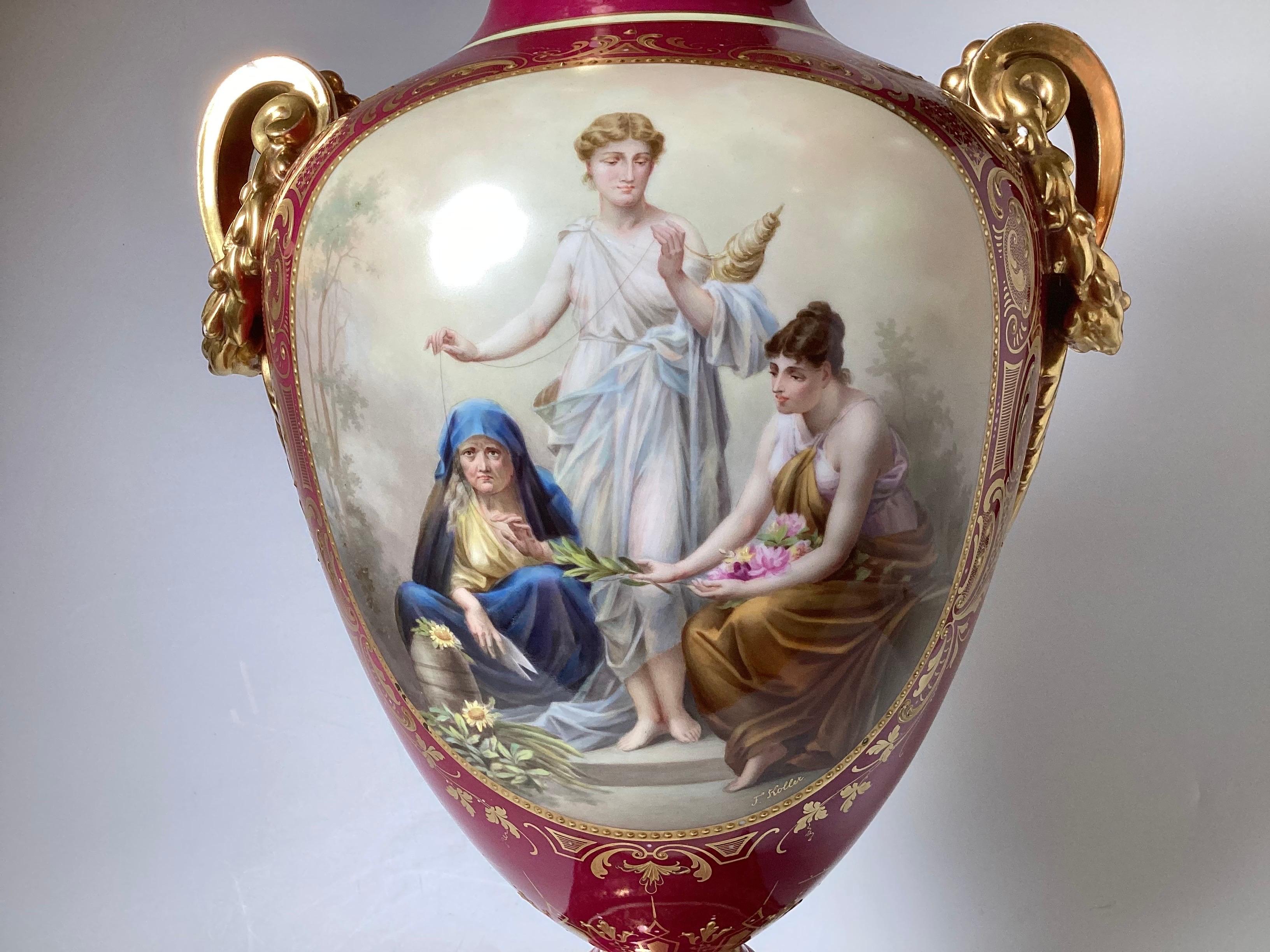 Very fine quality 19 century hand painted Royal Vienna Porcelain Vase in the Neoclassical Style. The fuchsia background with hand painted figural cartouches on the back and front.  The large vase with its original matching porcelain base.  
The