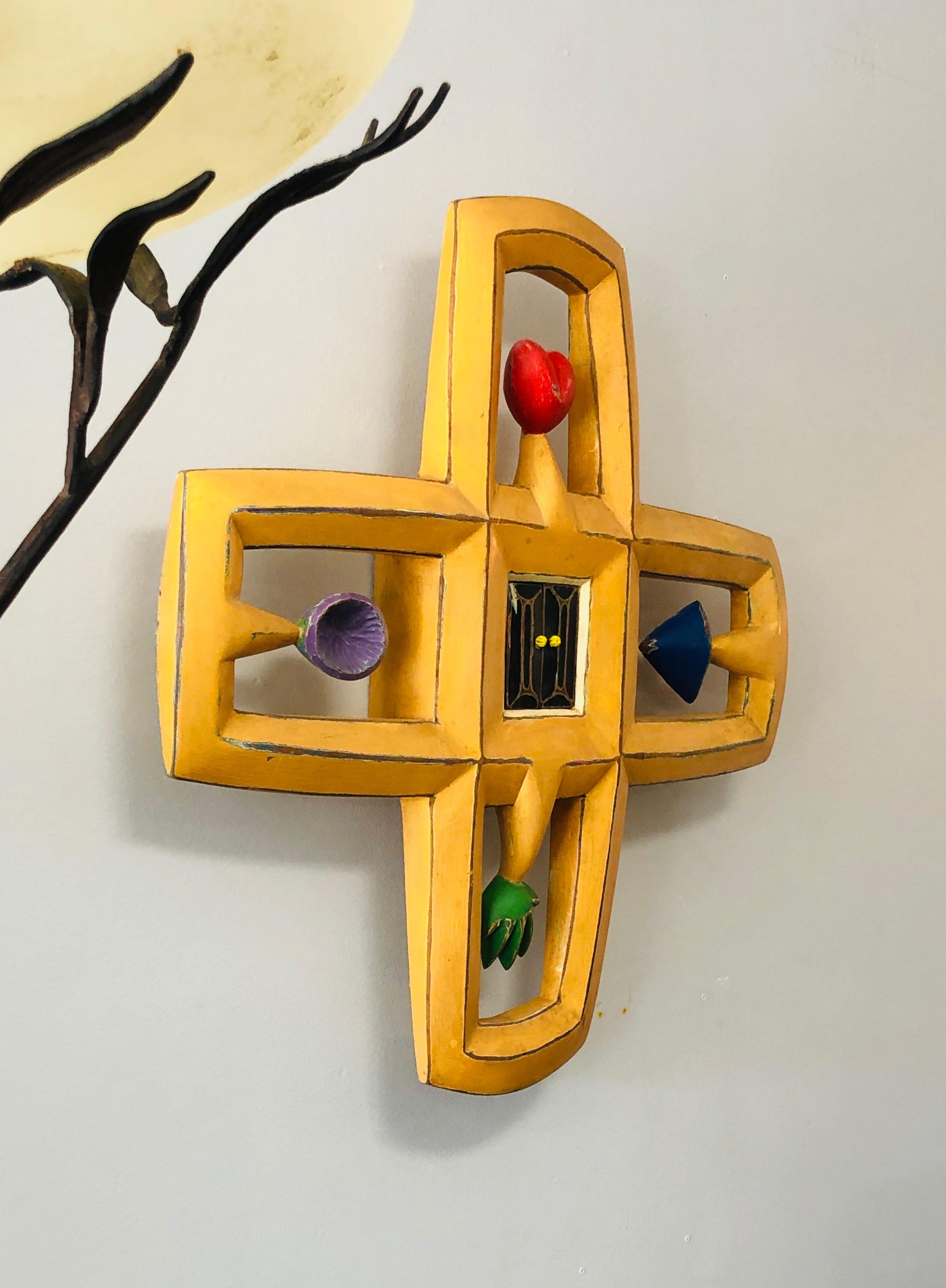 A wall sculpture by contemporary artist Randy Shull. Finished in colorful enamels.