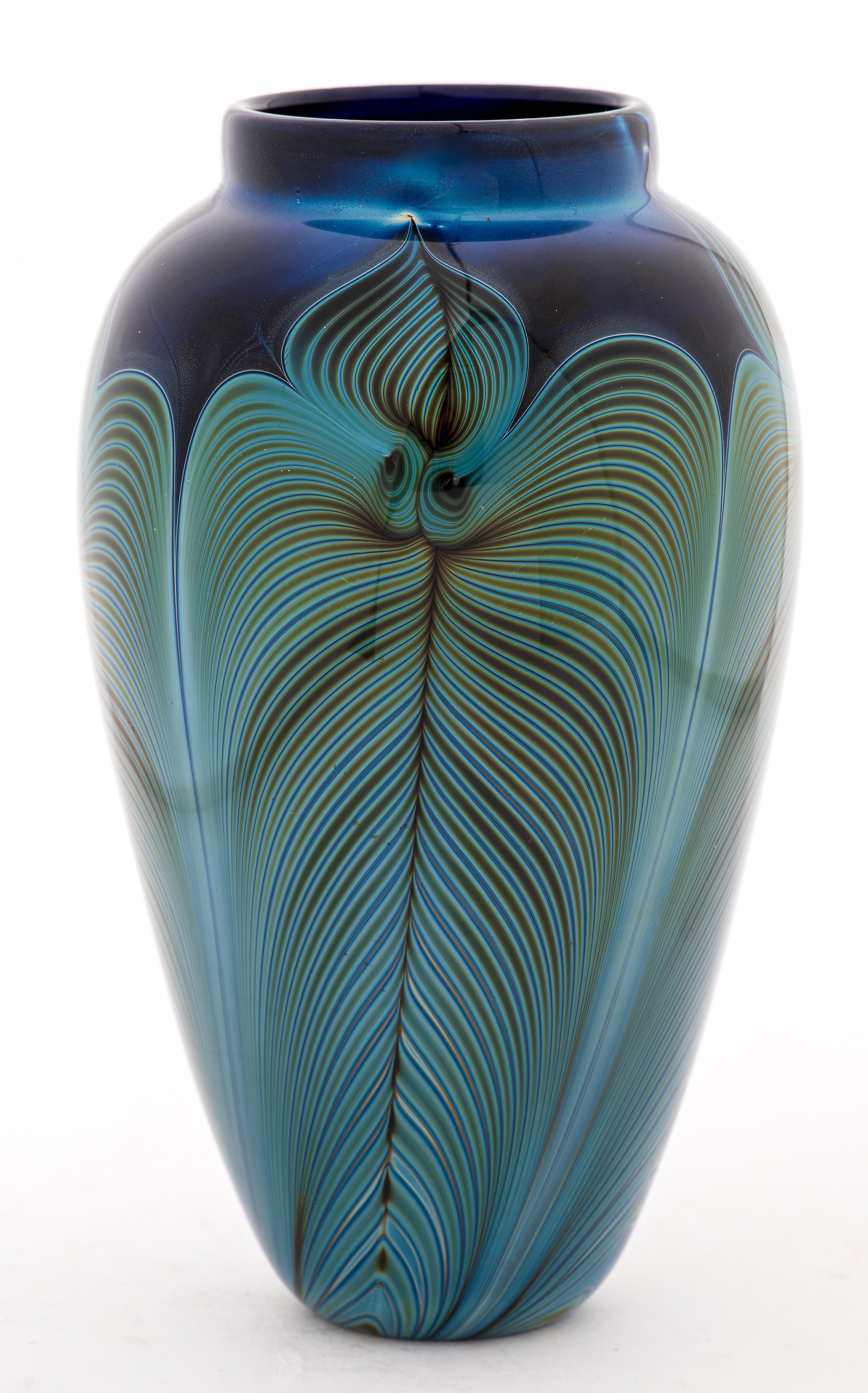 Randy strong art glass vase with feathered layered and cased glass design, incised signature on the bottom. 8.75