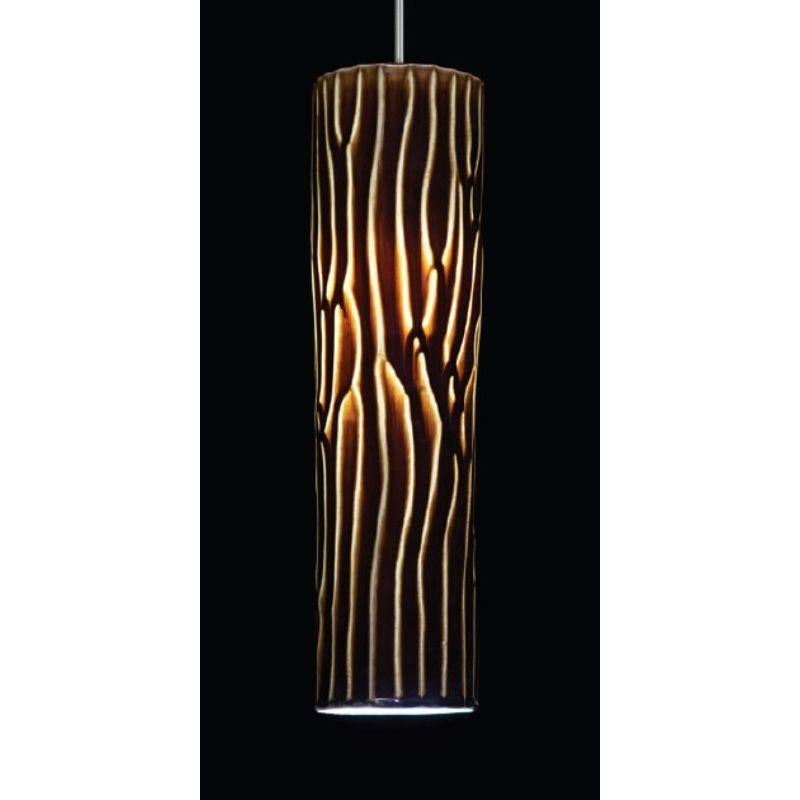 Range large pendant lamp with Dark Brown Glaze by WL Ceramics.
Designer: Jonas Lutz
Materials: Porcelain, brown glaze
Dimensions: H42 x Ø10 cm

Also available: in different colors (yellow, blue, dark brown), and in small size. 

All our lamps