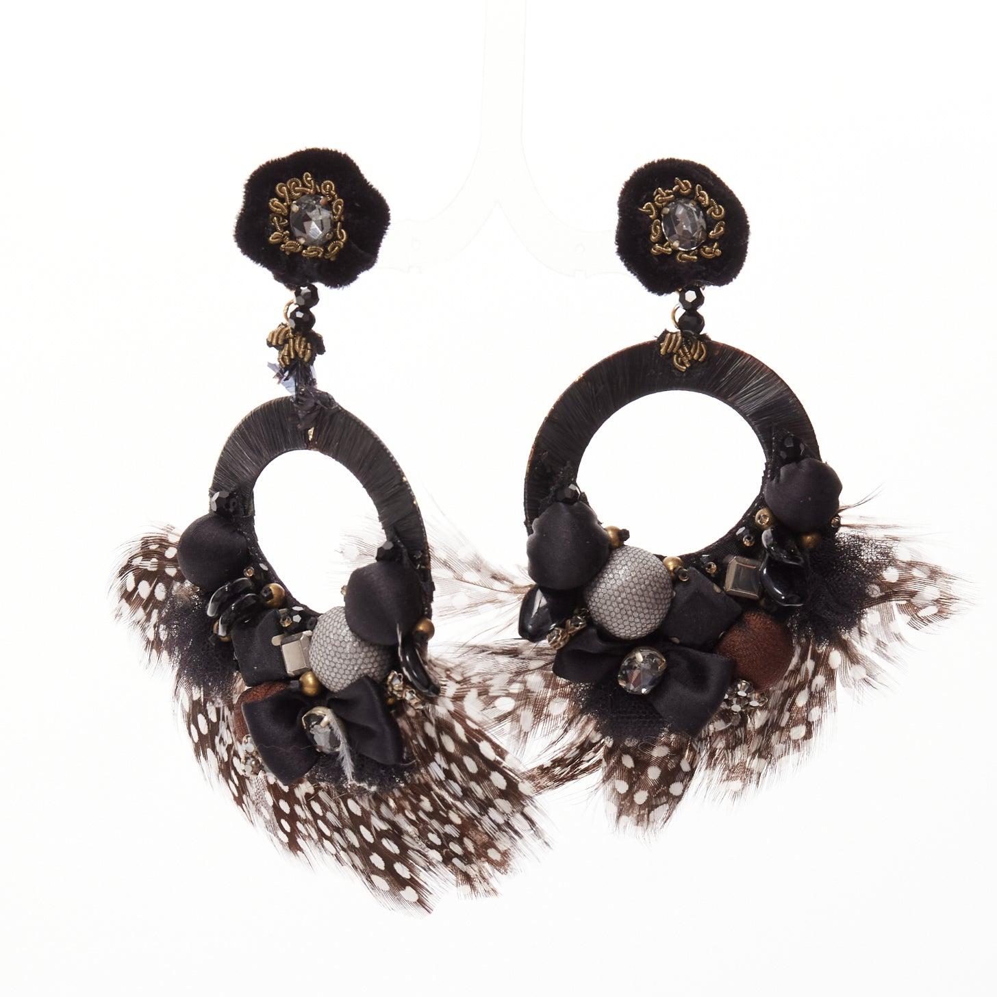 RANJANA KHAN black brown dotted feather beads bow dangling clip on earrings
Reference: AAWC/A01221
Brand: Ranjana Khan
Material: Feather, Raffia
Color: Brown, Black
Pattern: Feather
Closure: Clip On
Lining: Black Leather
Extra Details: Black leather